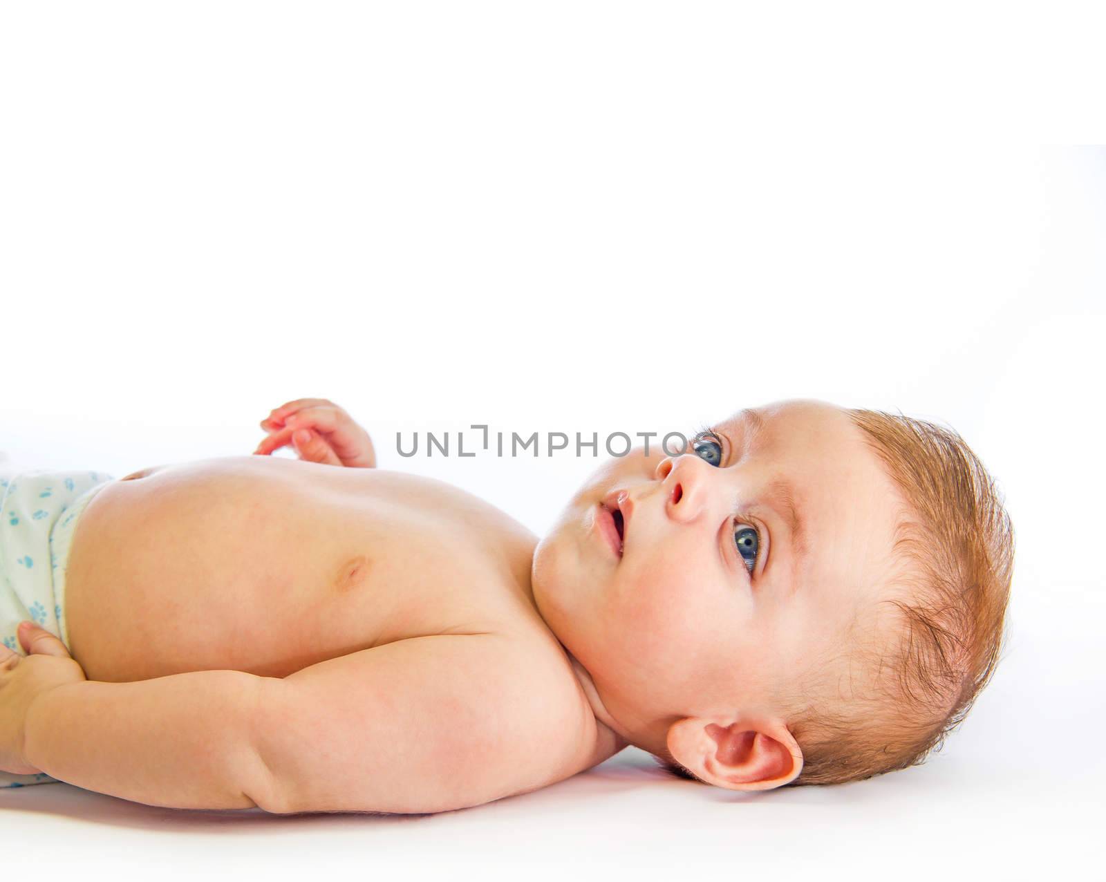 Lovely baby looking up on white background