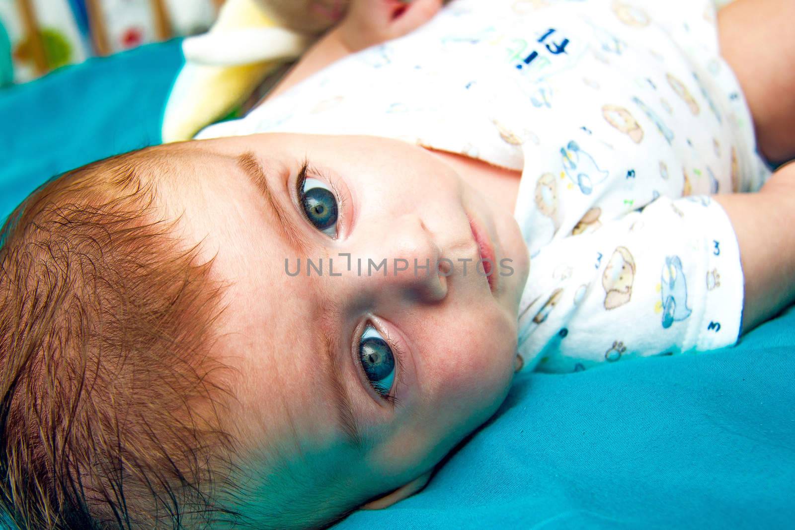 Cute blue eyed baby staring at the camera