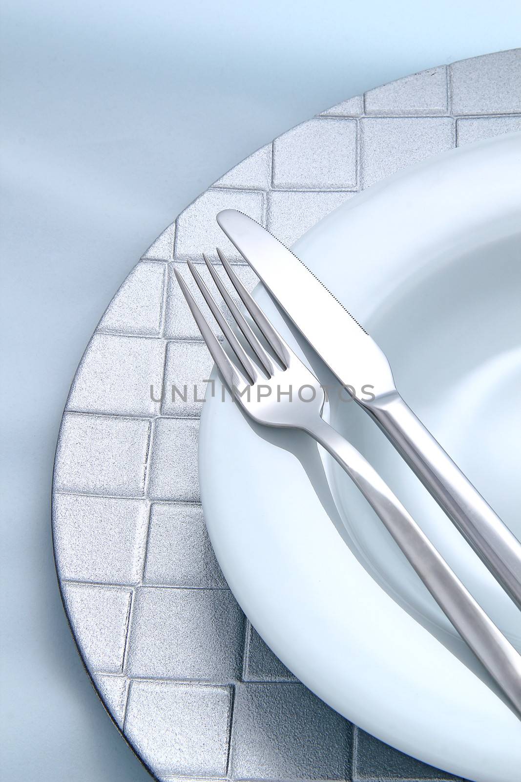 Silver Fork and knife on a dish