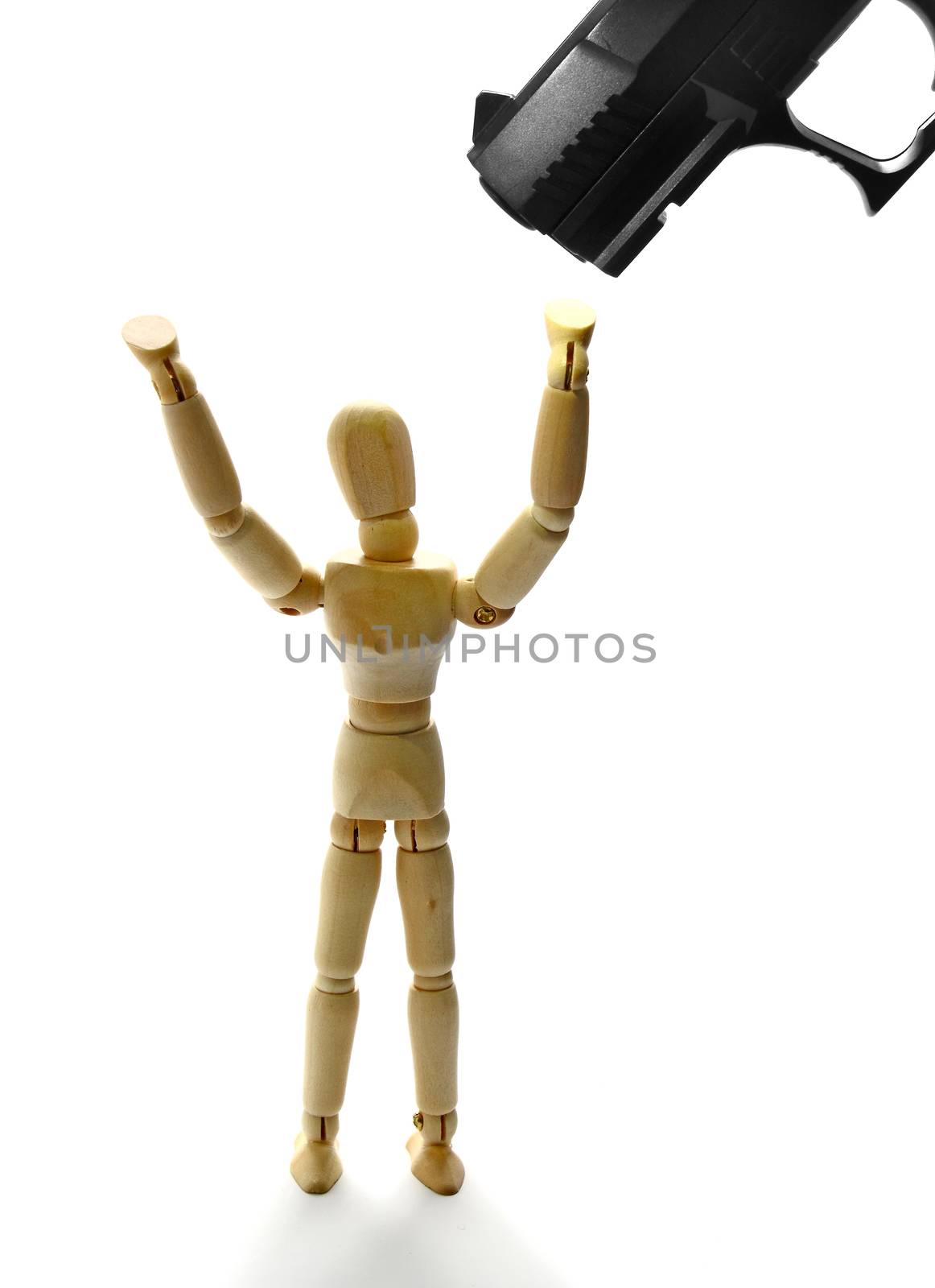 Manikin with hands up and a gun pointed