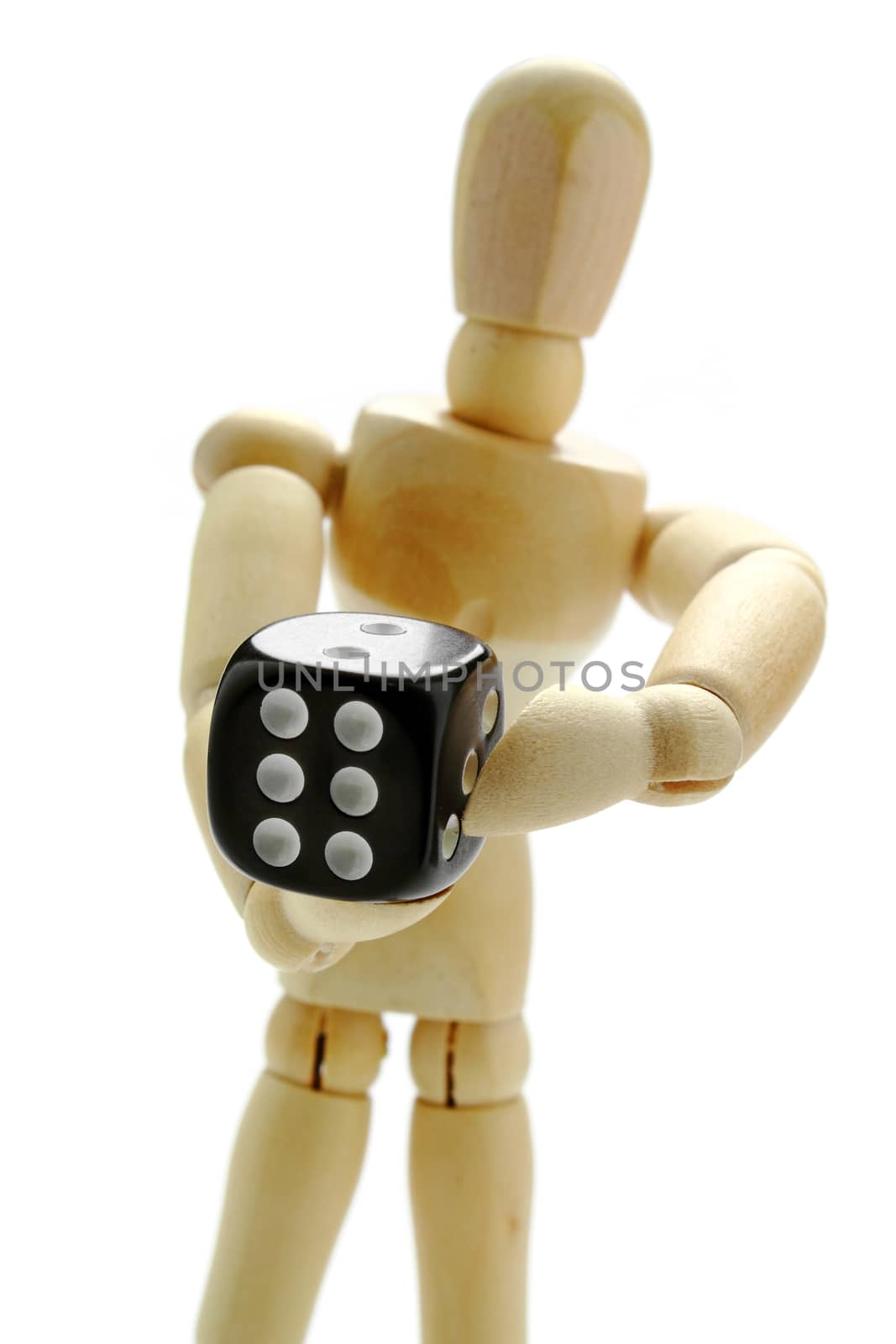Wooden manikin and dice by dynamicfoto