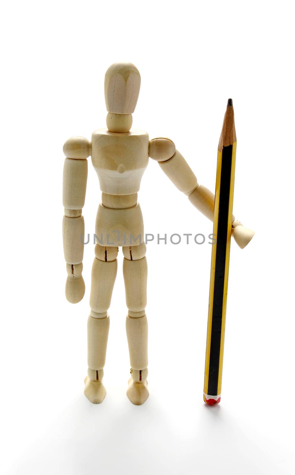 Wooden mannequin holding a pencil by dynamicfoto