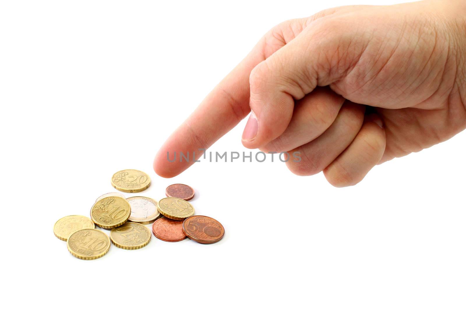 A hand pointing to a few coins