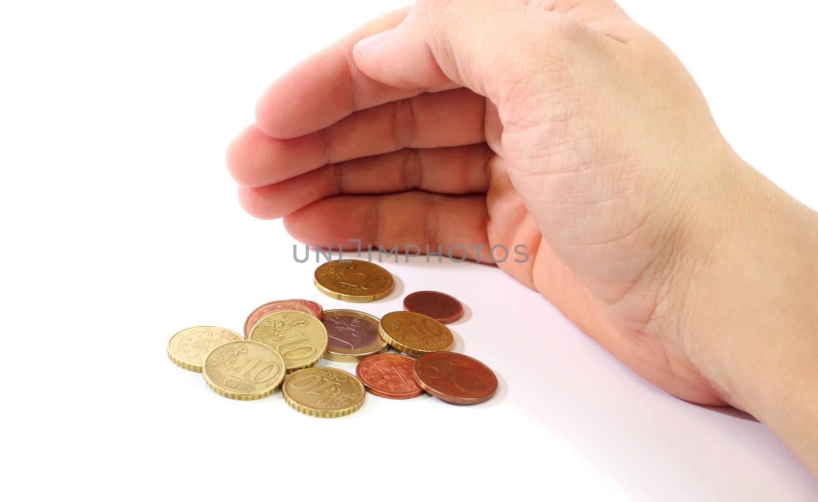 A hand in shell shape covering money