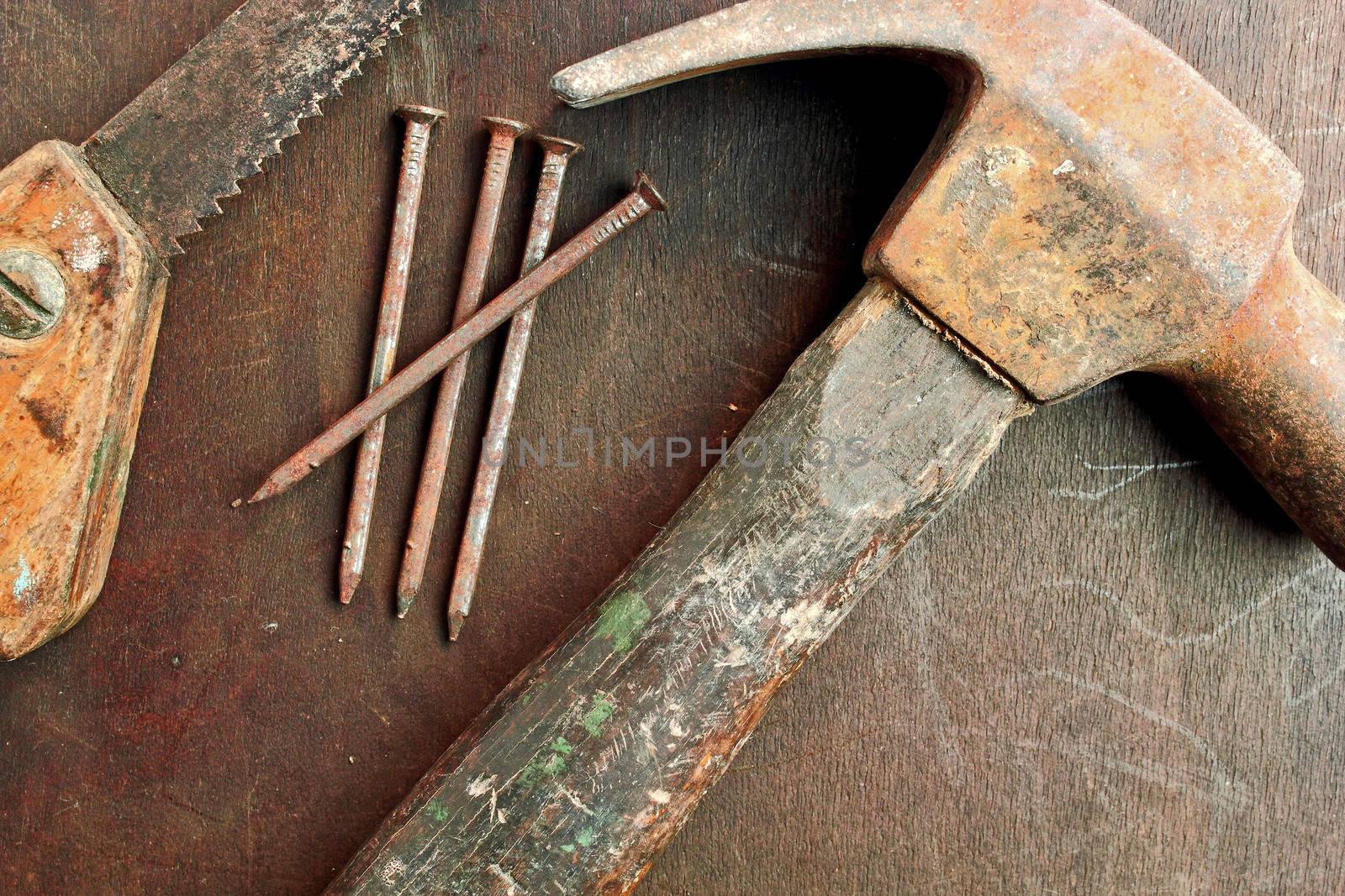 Old hammer nails and a small hand saw