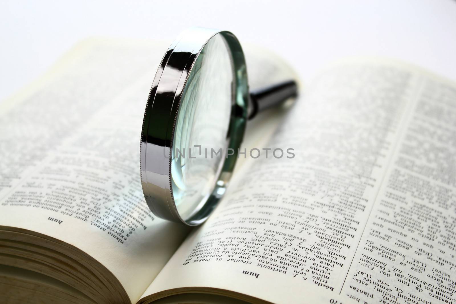 Magnification glass over a opened book
