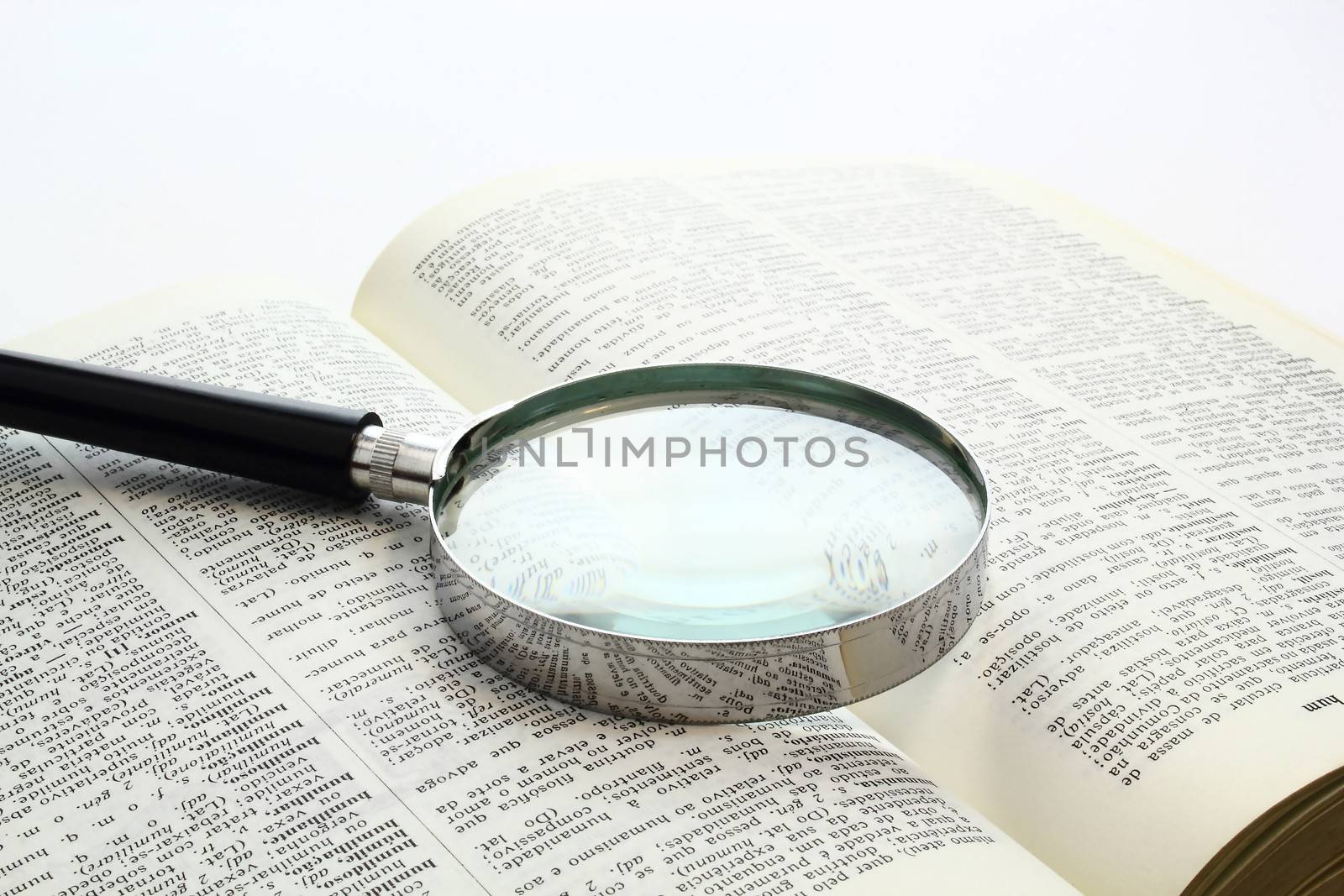 Magnification glass over a opened book