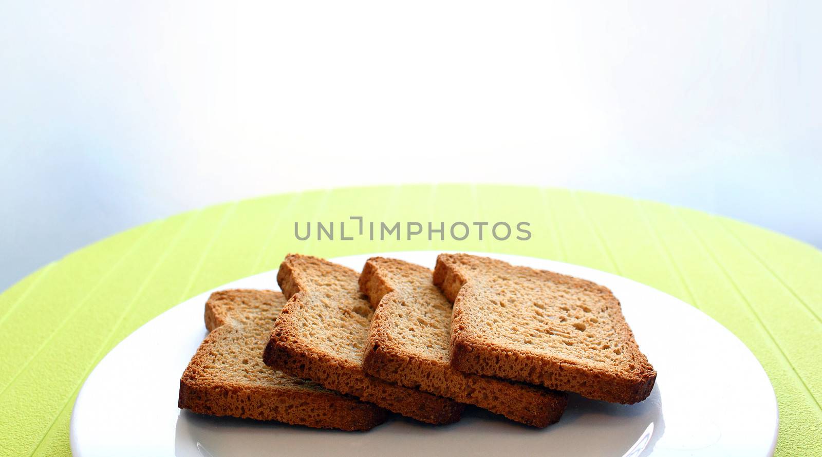 Background of four toasts over a white dish