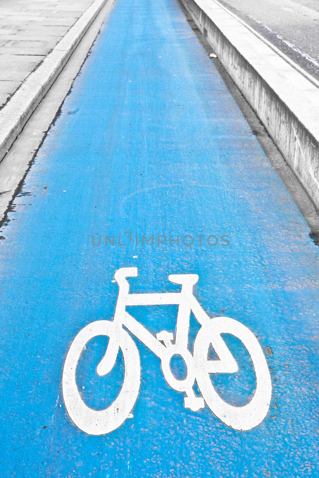 Blue designated cycle path in a city