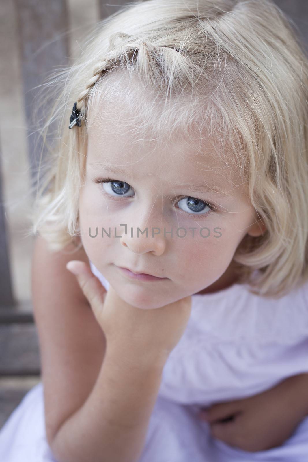 4 year old serious child looking at camera