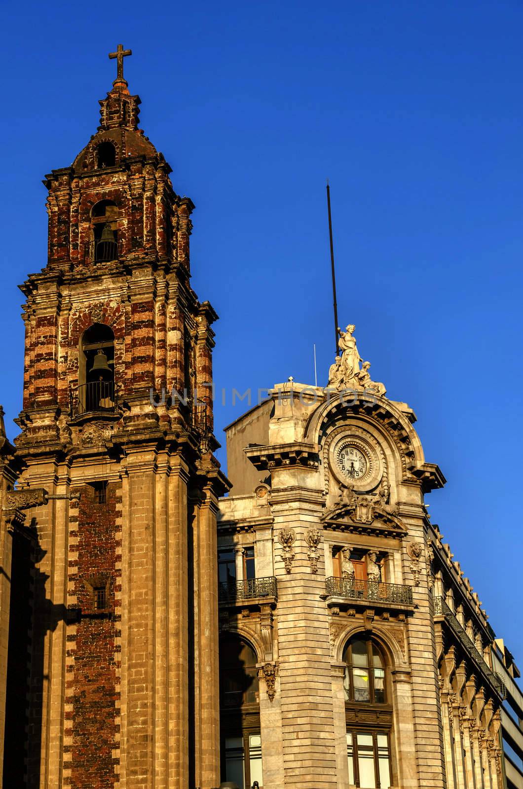 Old historic building next to spire of a church