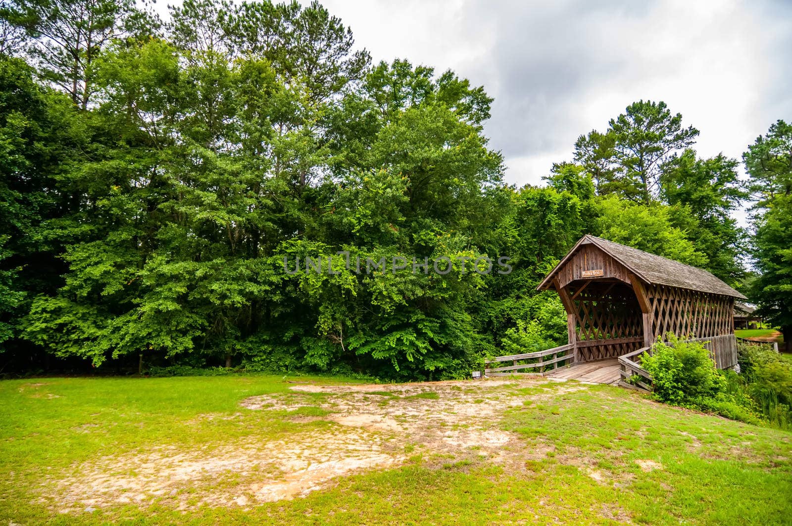 old wooden covered bridge in alabama by digidreamgrafix