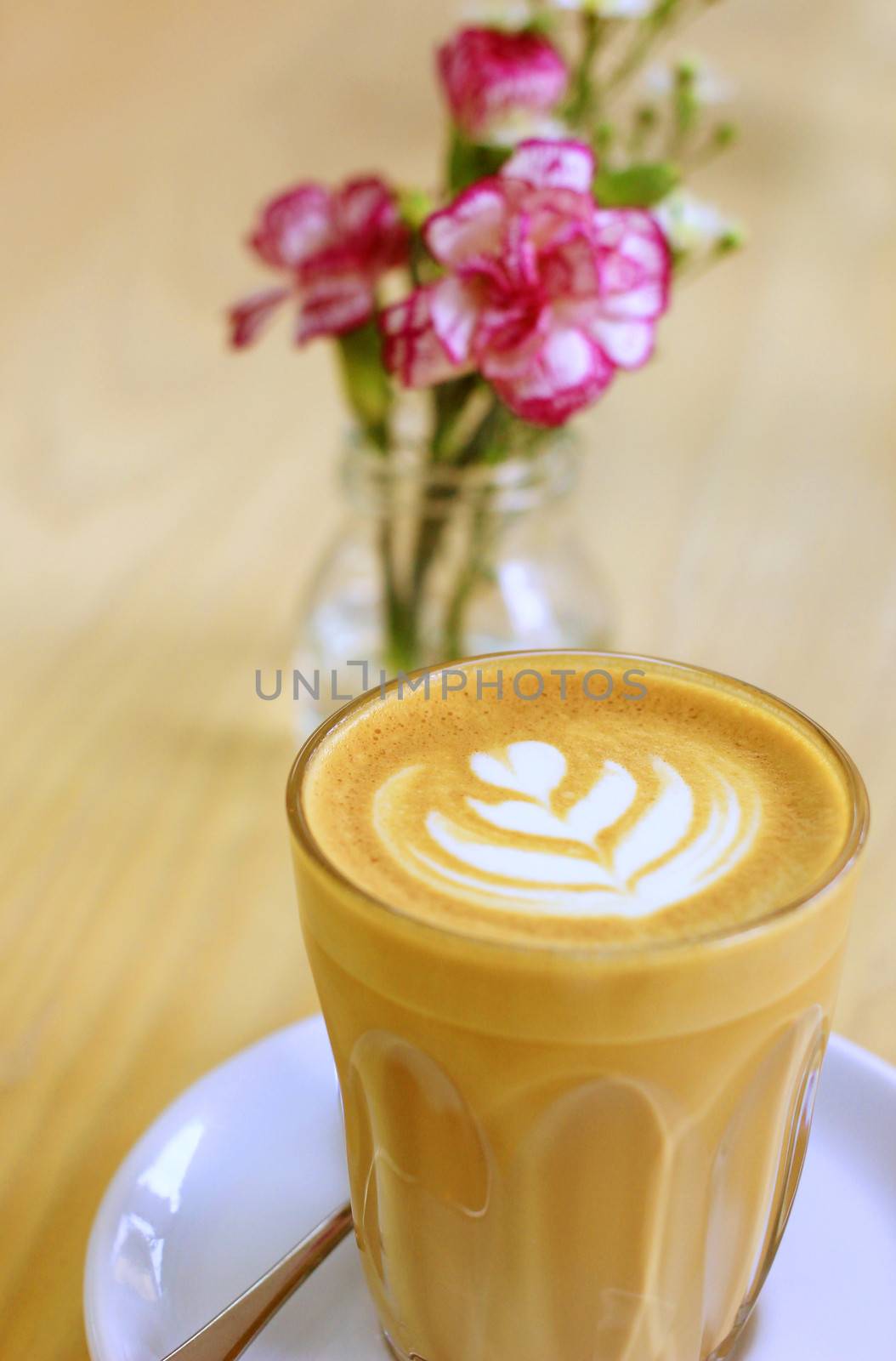 Cup of art latte or cappuccino coffee with flower by nuchylee