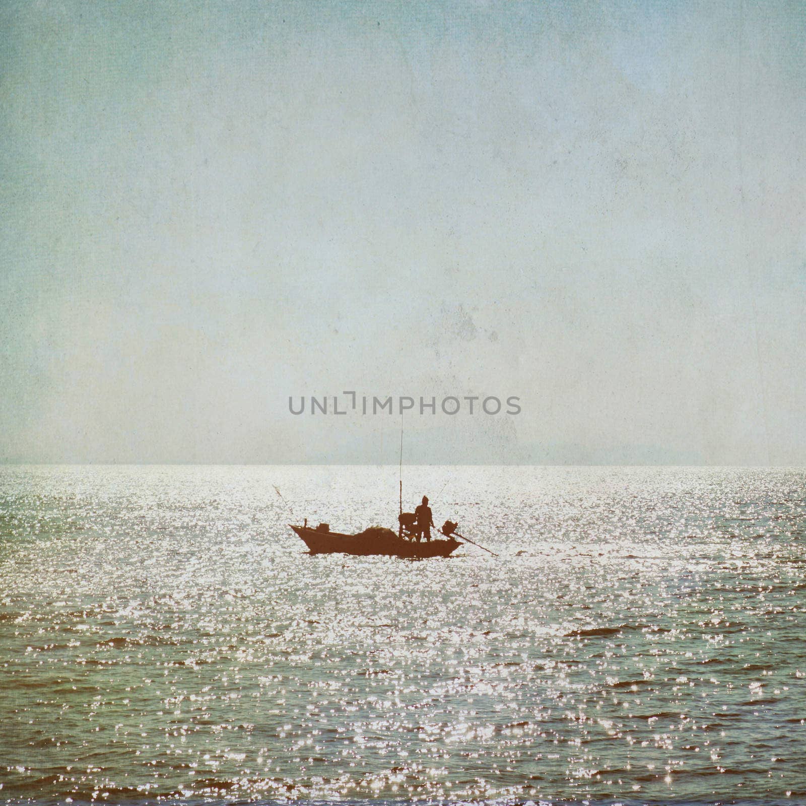 The silhouette of fisherman with boat in the sea vintage backgro by nuchylee