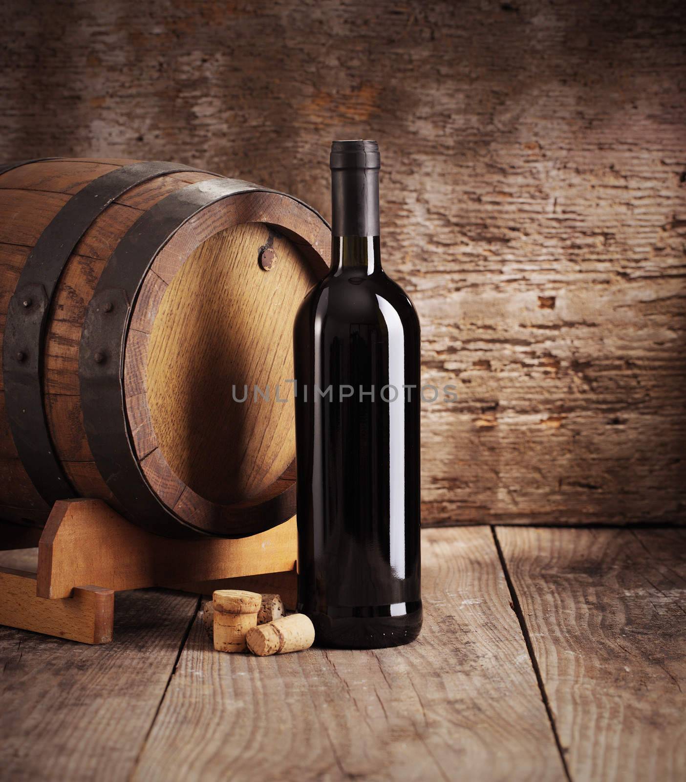 Red wine bottle with barrel and corks