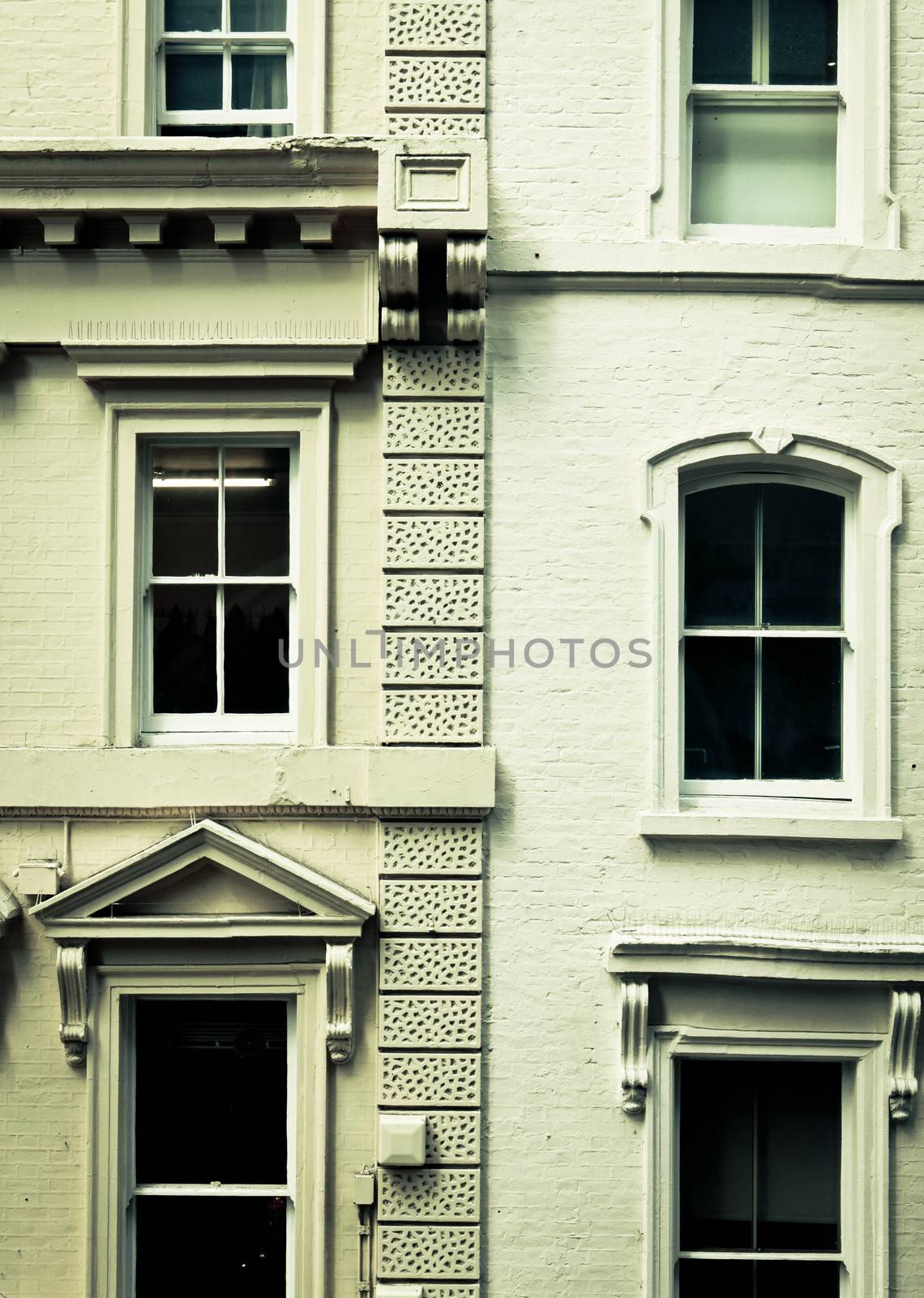 Neighbouring three storey town houses in London