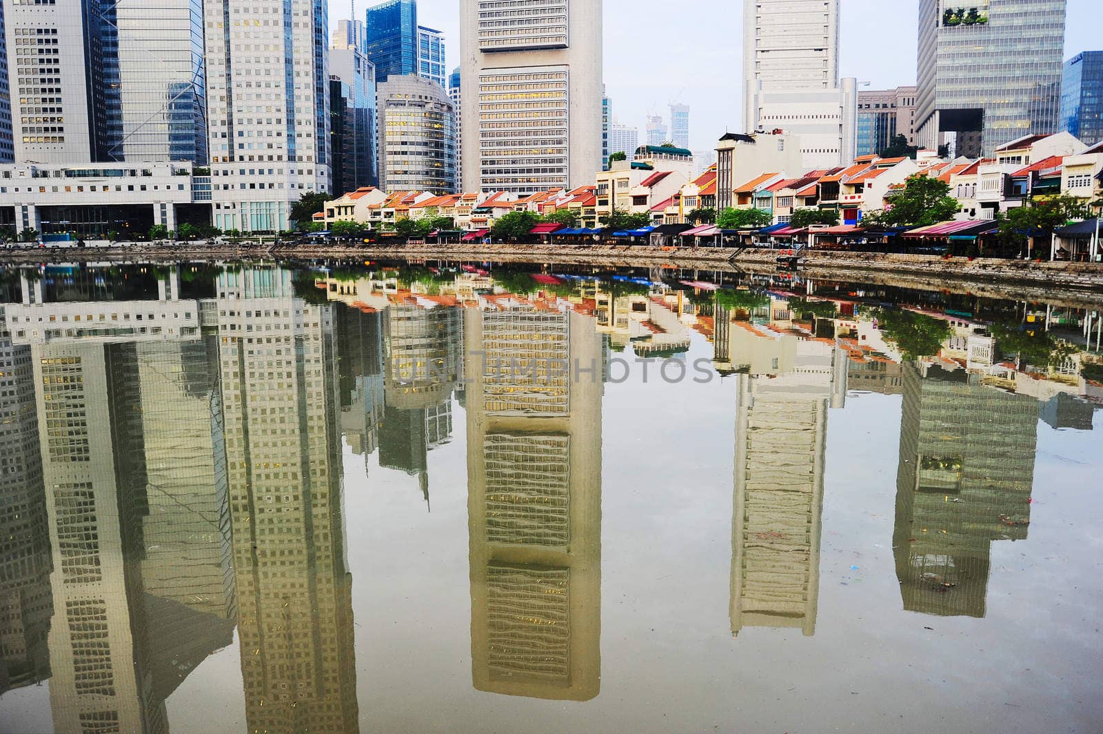 Boat quay in Singapore with reflection in a river