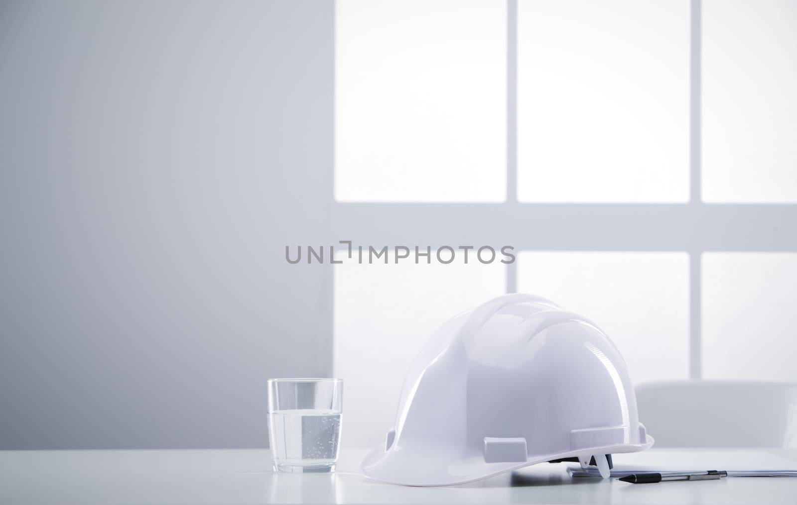 desk engineer with hardhat by stokkete