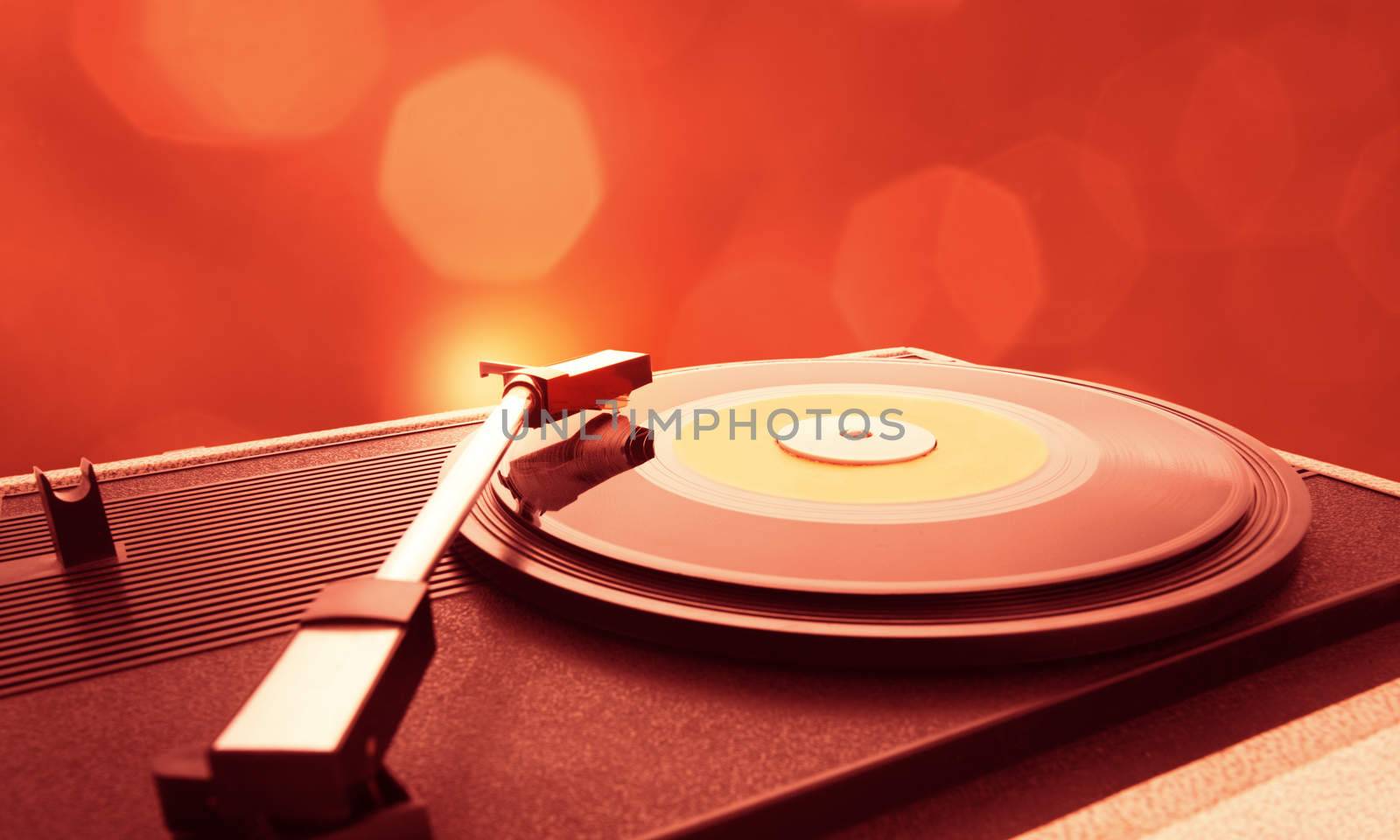A vinyl record is spinning on the turntable