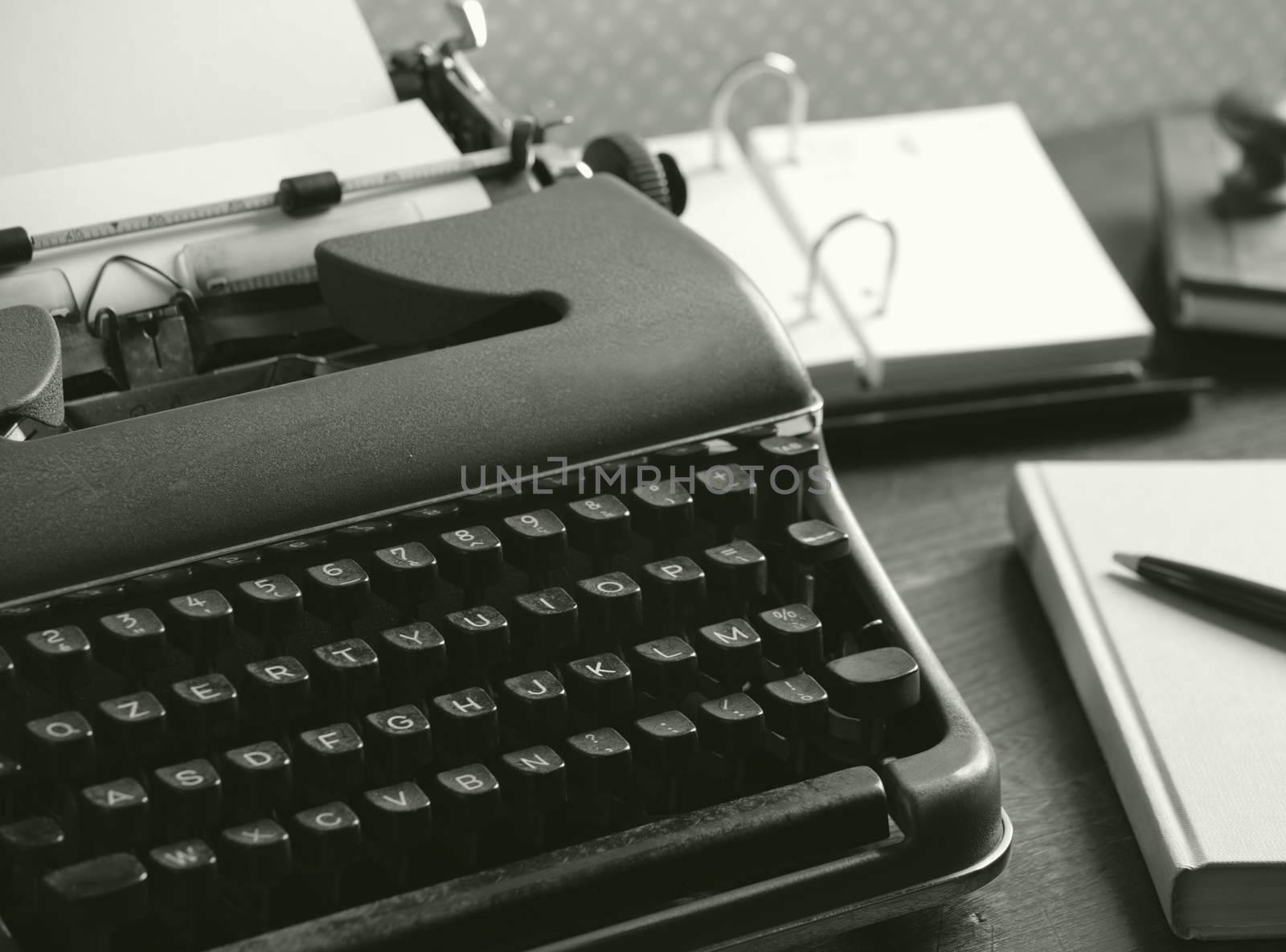 Close up fo an old typewriter on a wooden desk