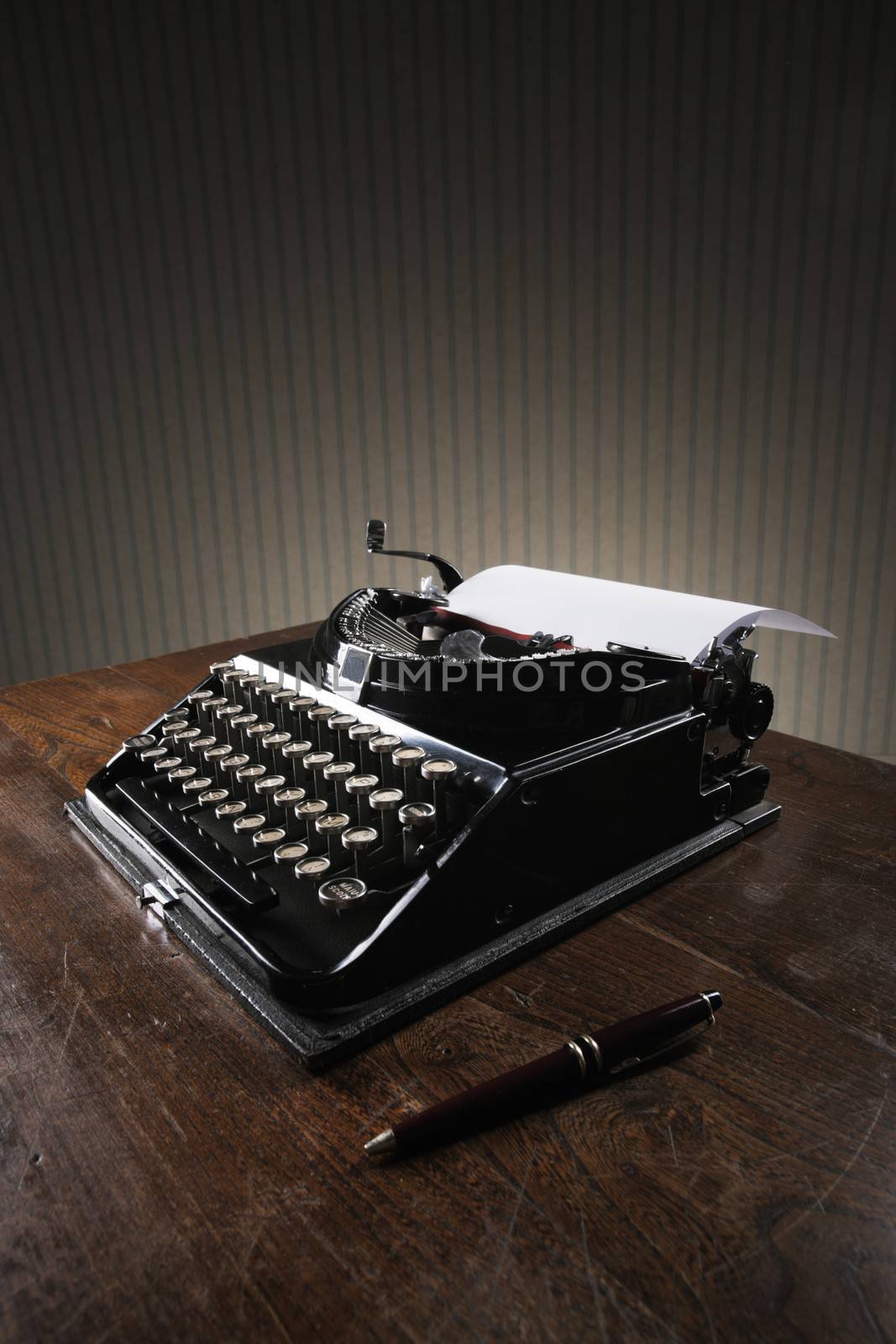 Old typewriter on a wooden desk