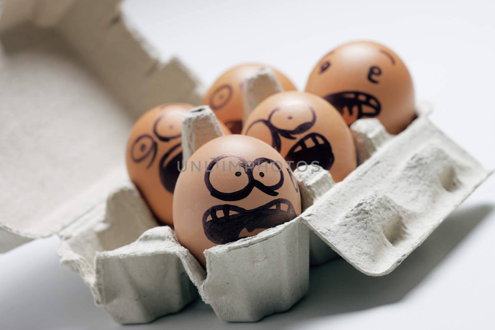 funny eggs with facial expression: scared, screaming and being terrified.