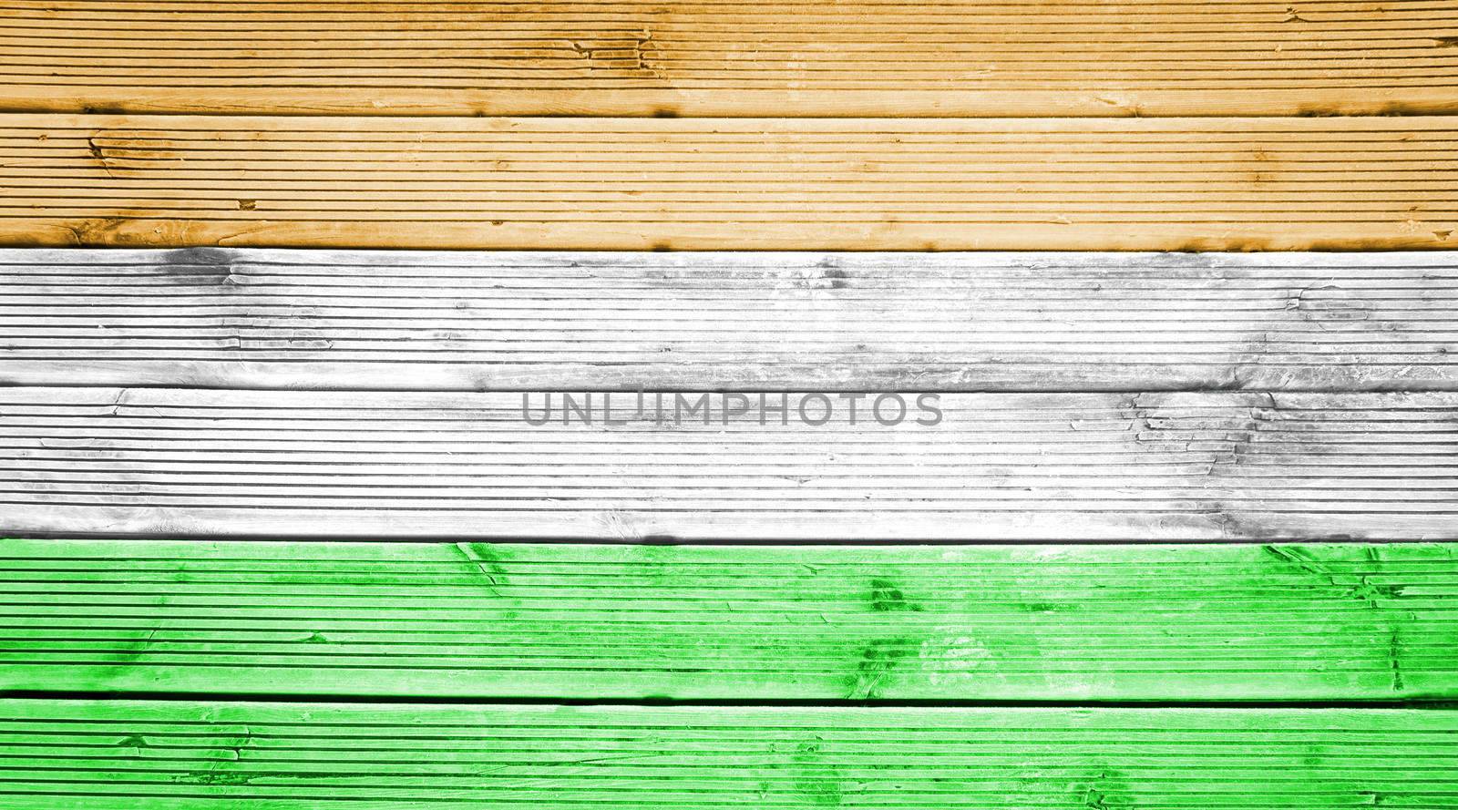 Natural wood planks texture background with the colors of the flag of India