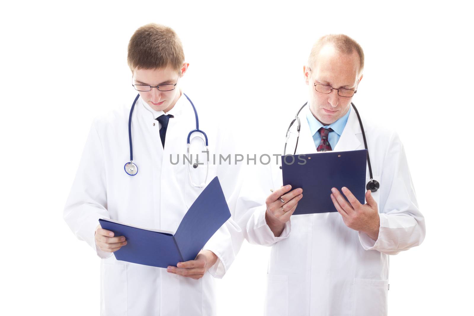 Medical doctors reading patients records by gwolters