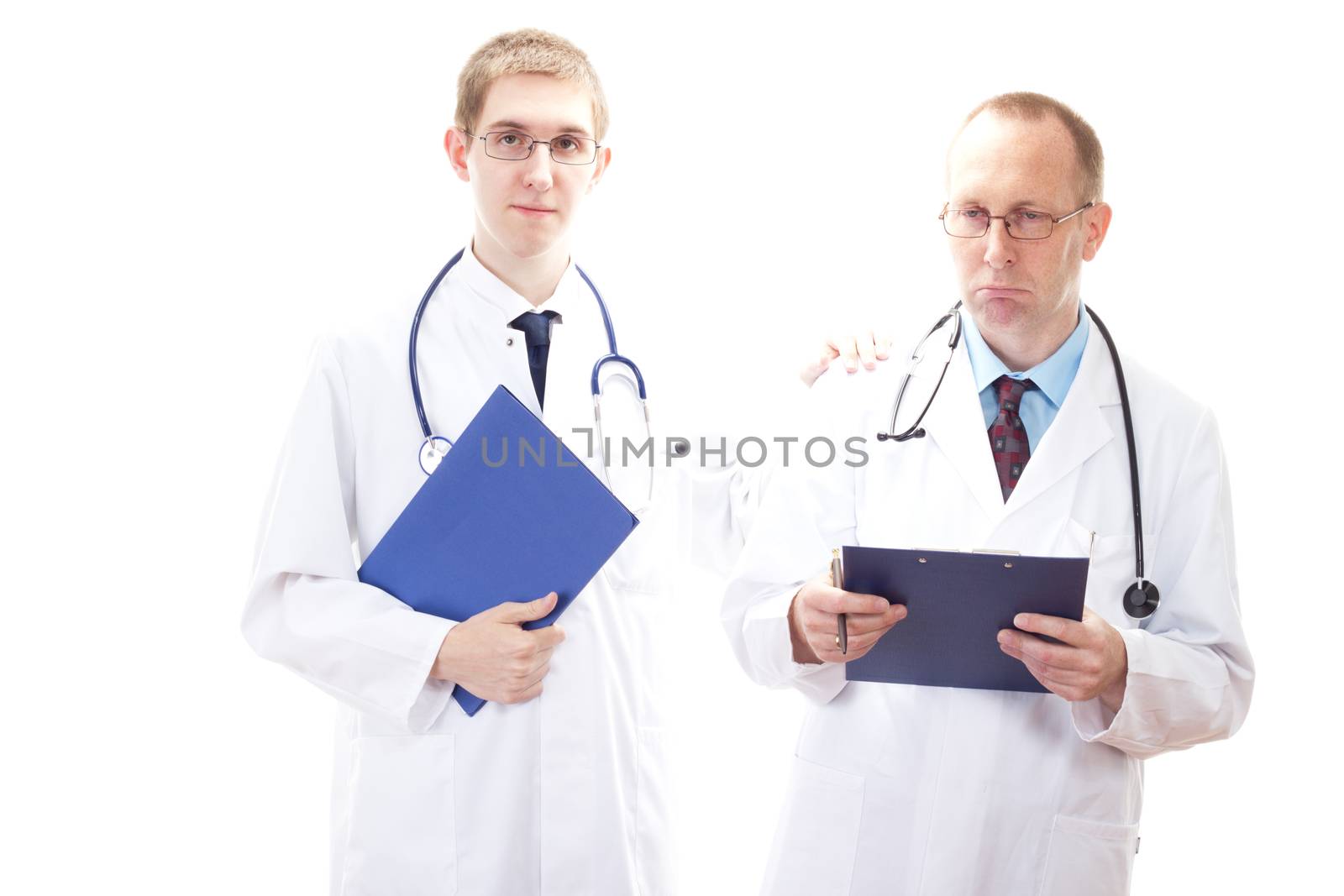 Young medical doctor cheering depressive doctor up by gwolters