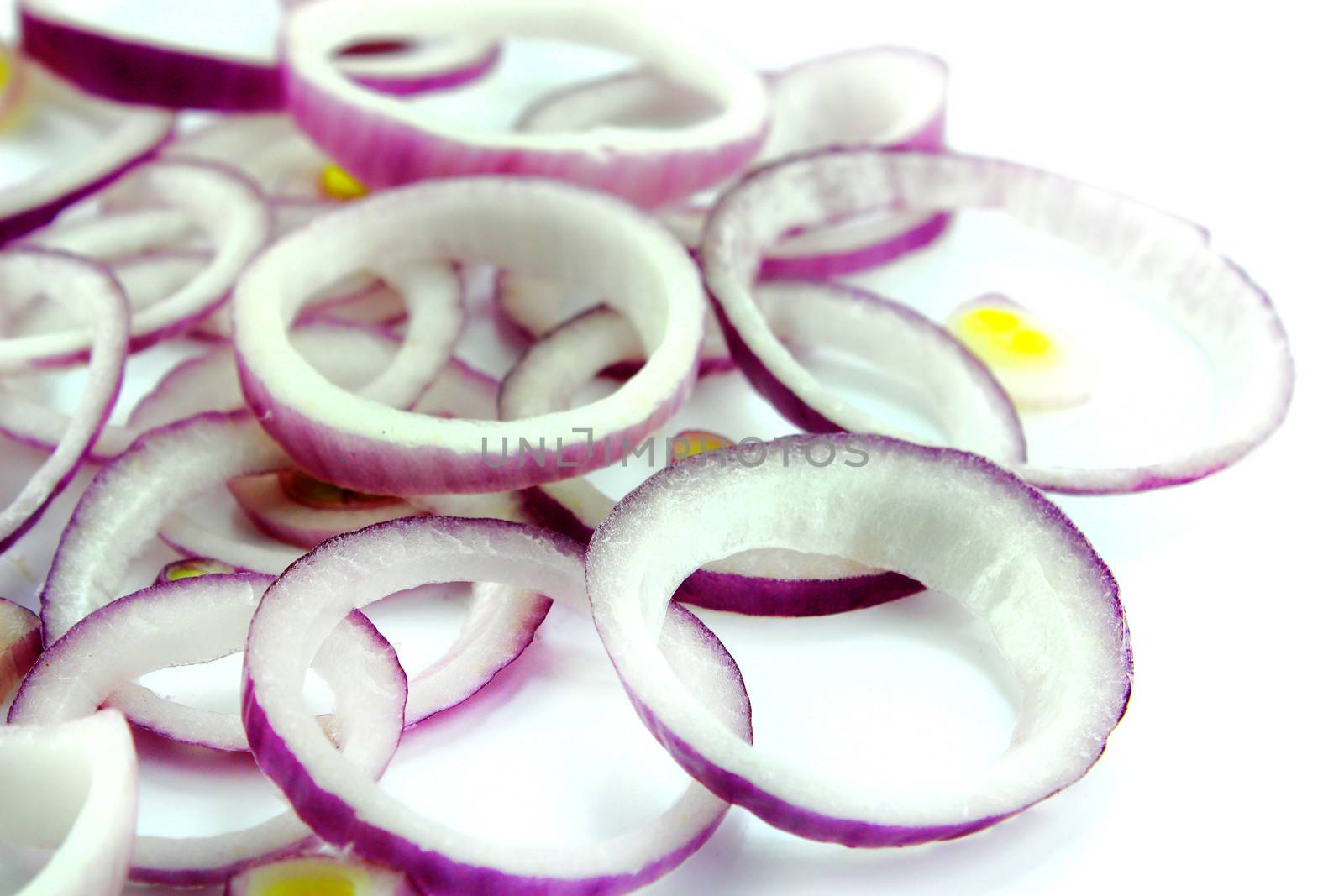 Red sliced onion on white background.