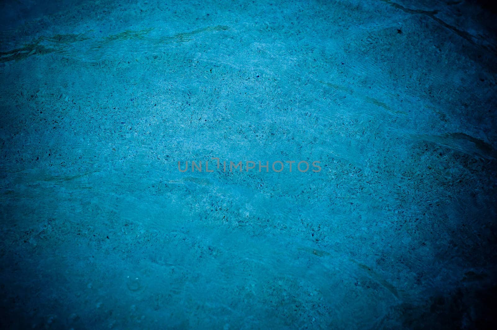Blue pool water textured background.