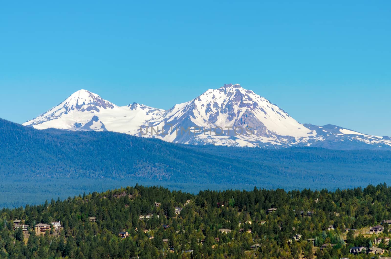 View of the snow covered Three Sisters mountains in the Cascade Range