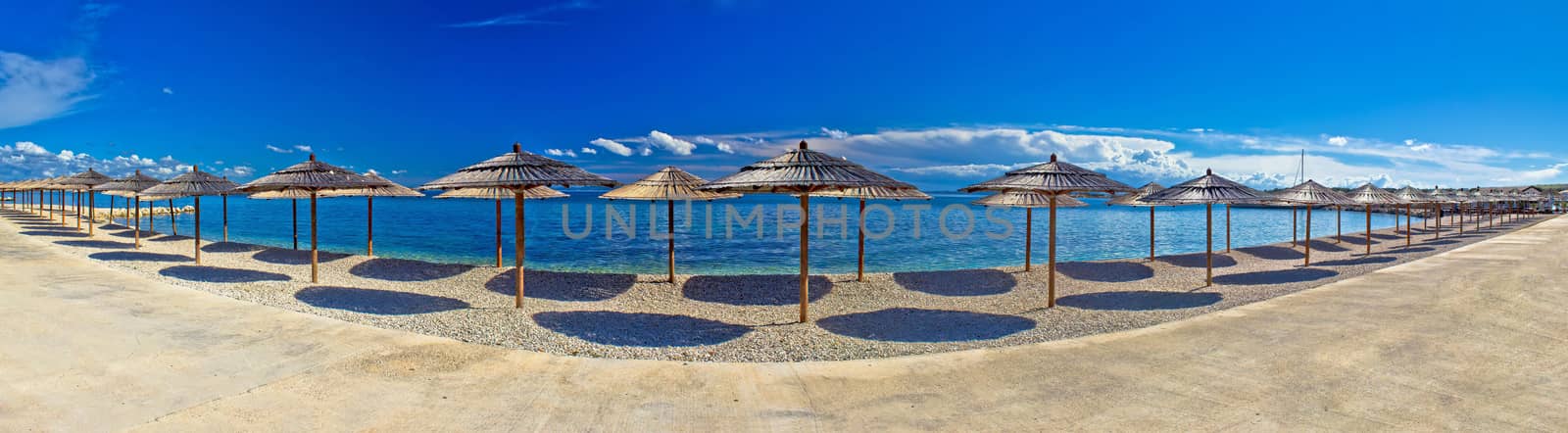 Pebble beach and umbrellas panoramic view, Island of Vir, Dalmatia, Croatia