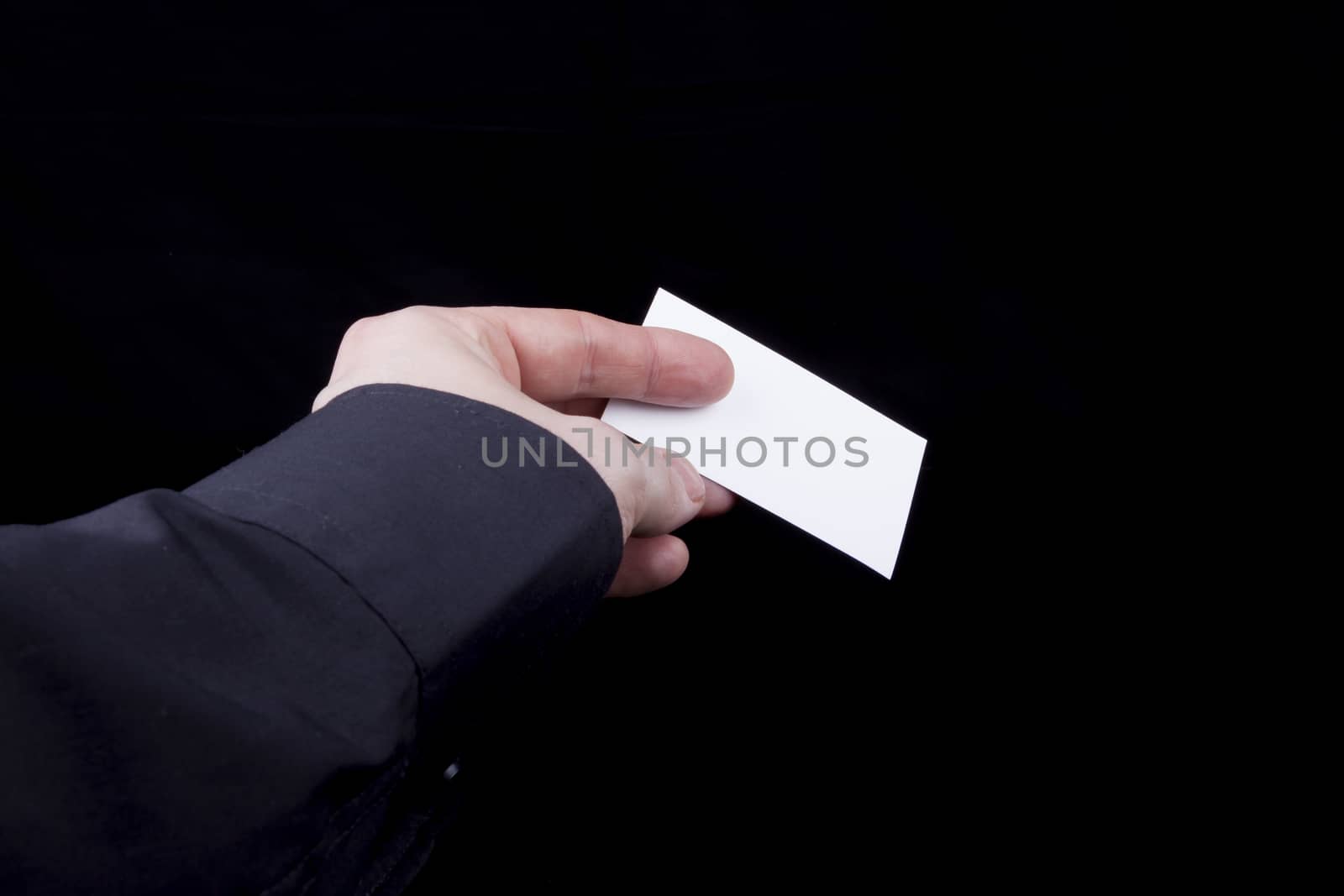 Man hand holding a blank business card.