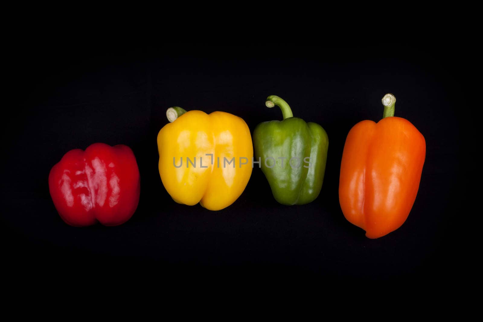 Multi-Colors peppers isolated on a black background