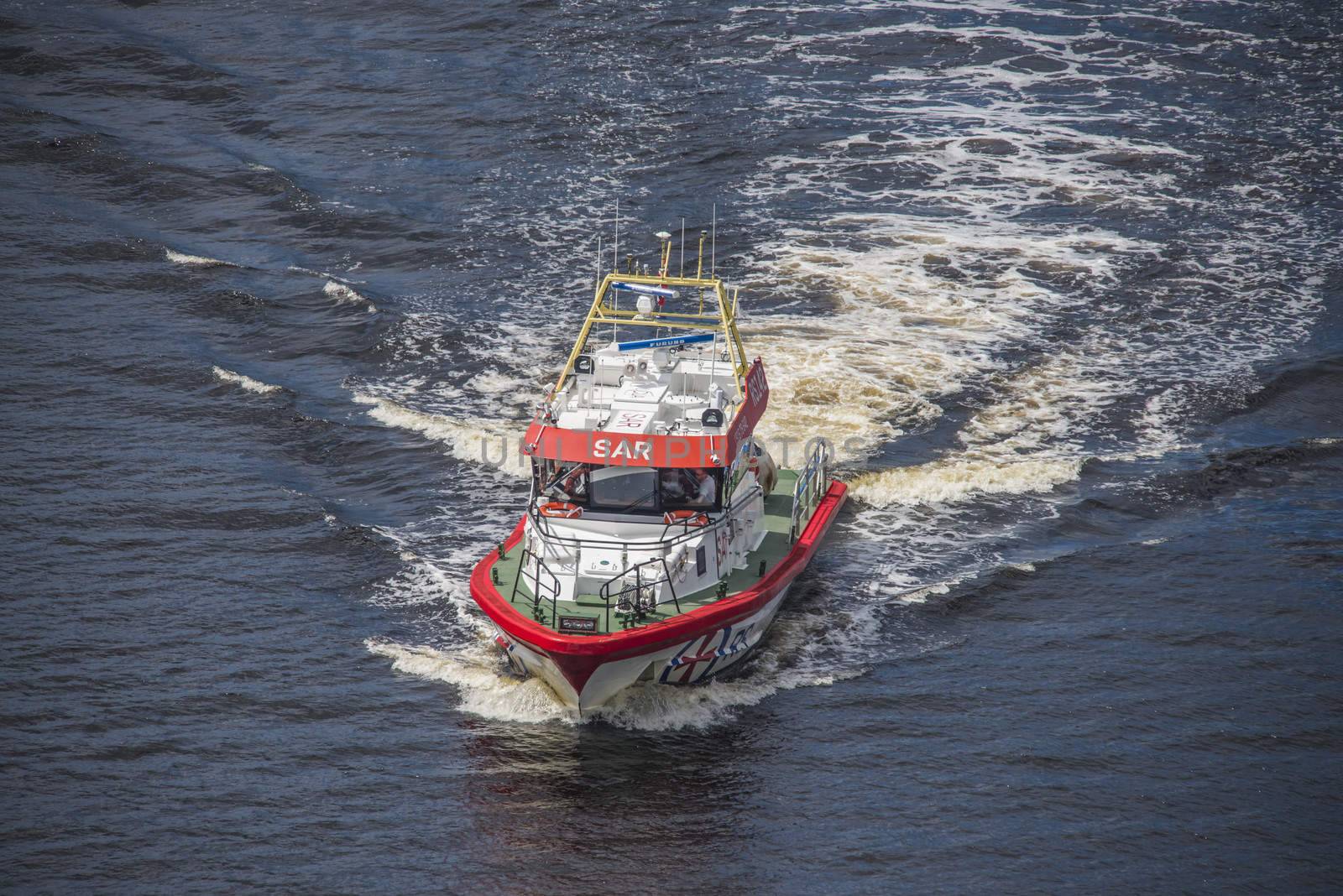 Rescue boat RS 142, Horn Flyer escorts MS Sj��kurs with NRK through Ringdalsfjord, heading for the port of Halden. Photo is shot from Svinesund bridge, Halden, Norway.