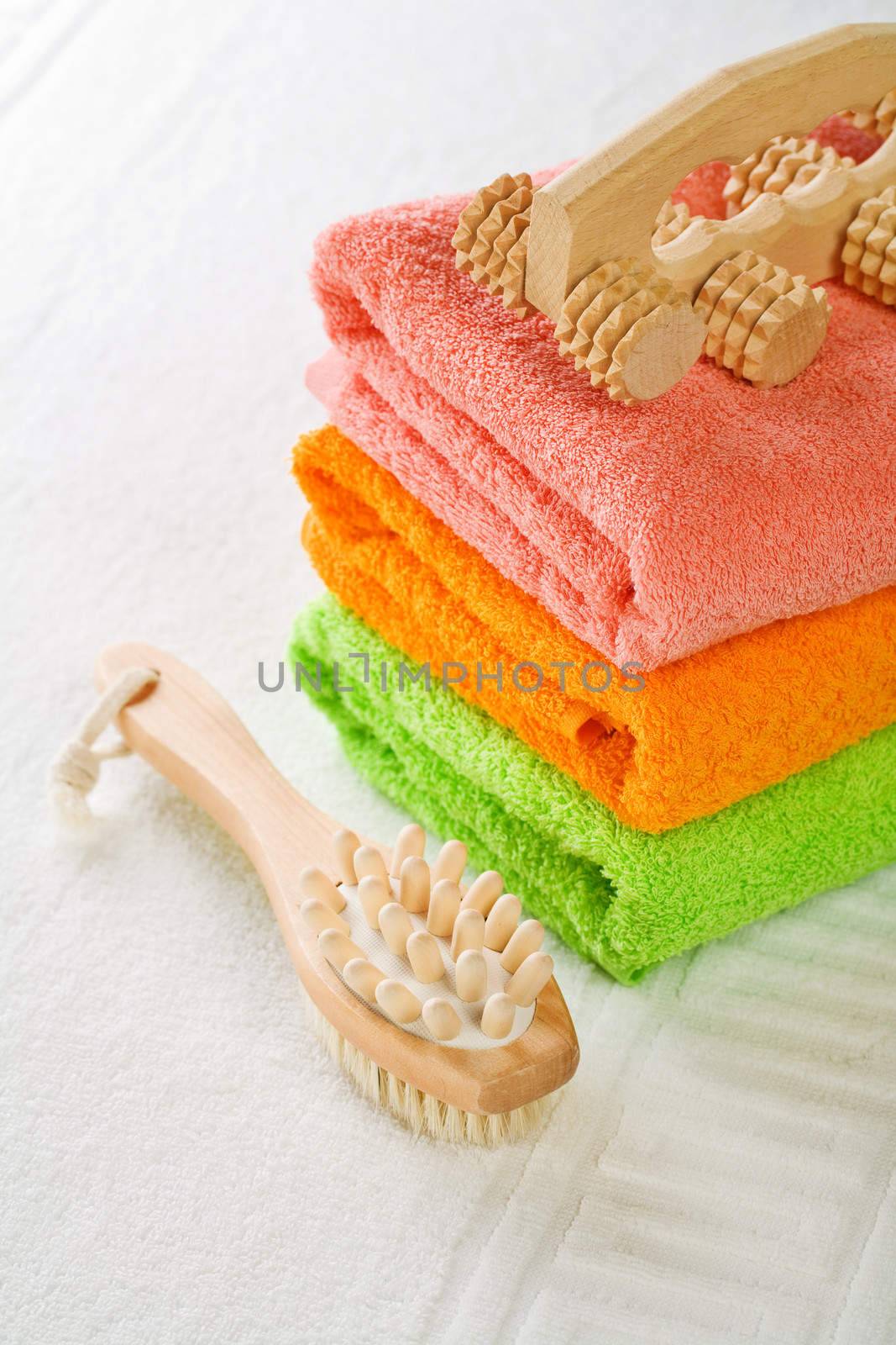 brush massager and towels