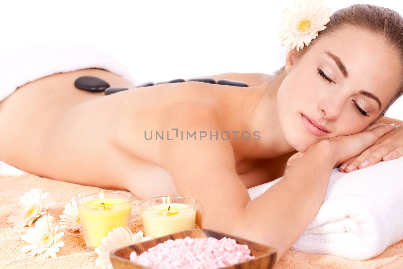 young attractive woman hot stone massage wellness isolated on white