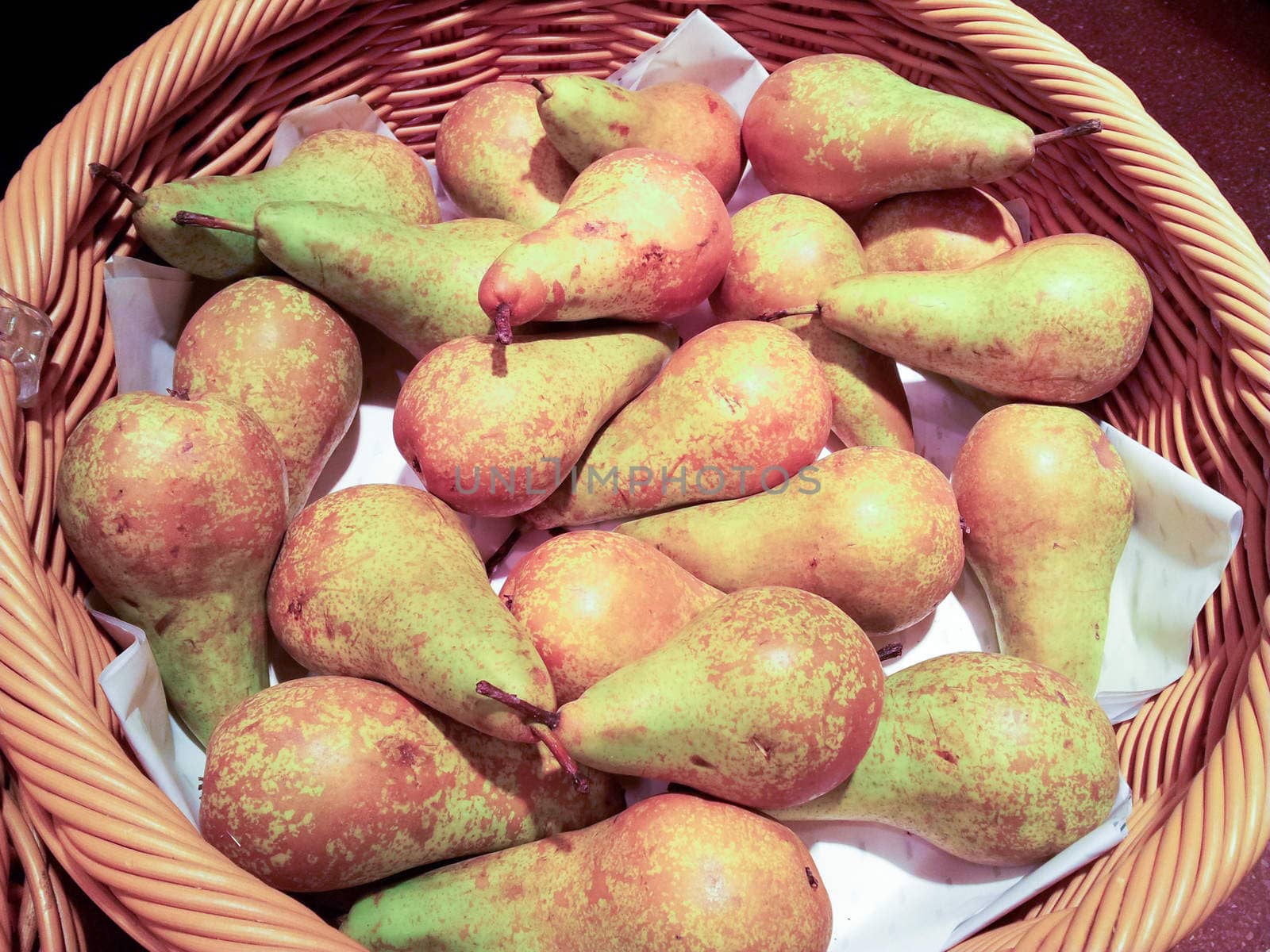 Pears collected in a basket at harvest