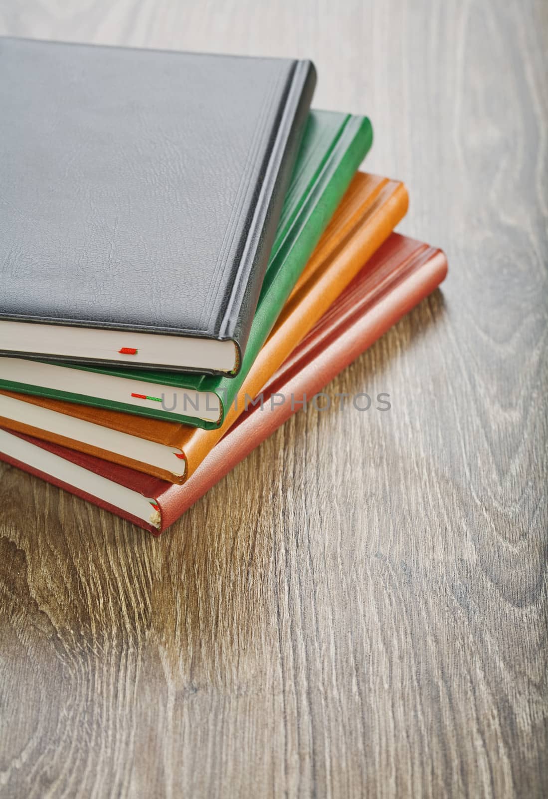 notebooks on wooden board