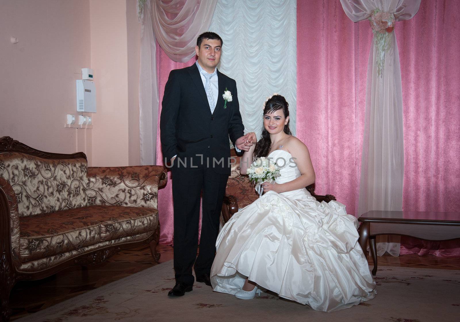 bride and groom in the living room