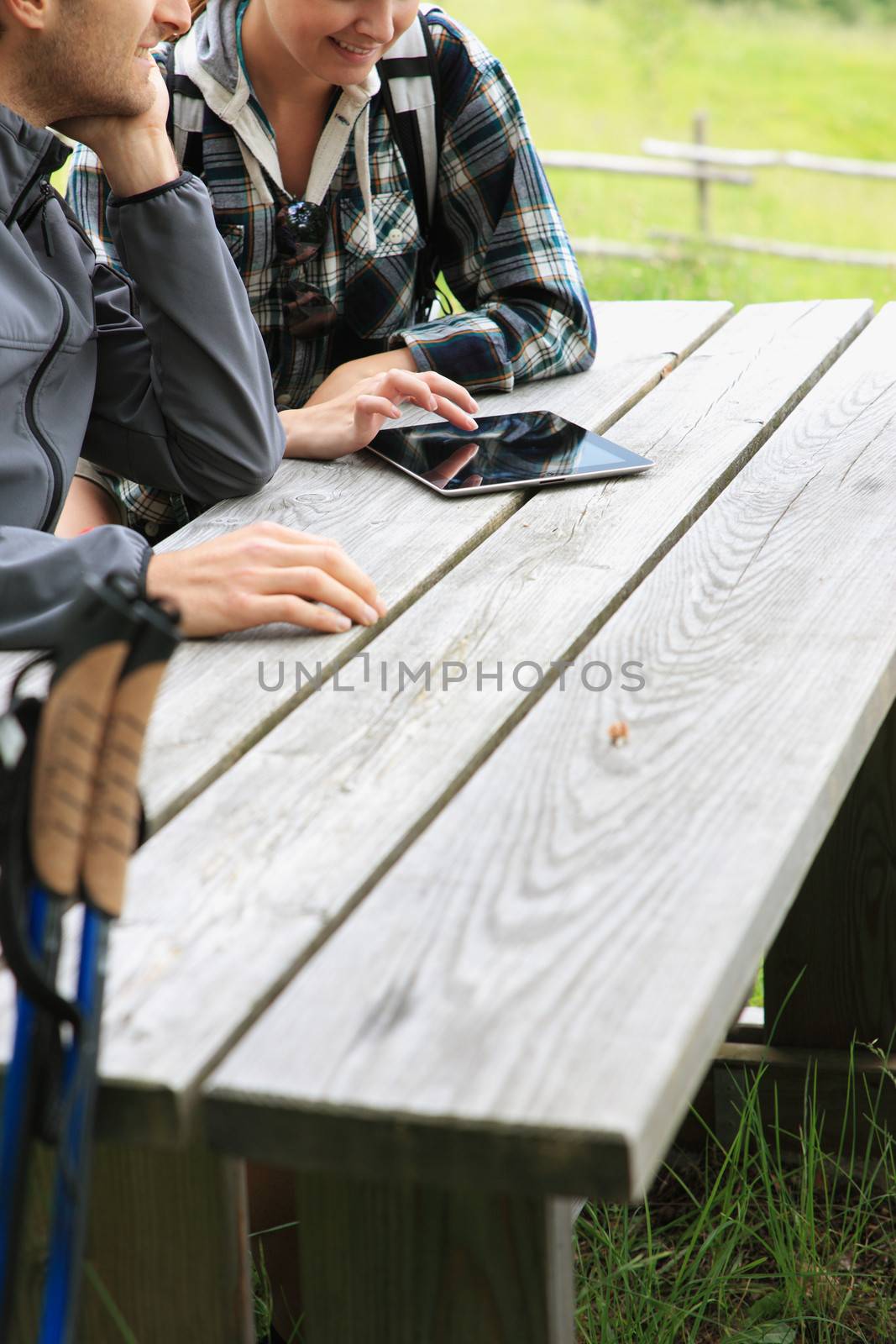 Couple using tablet by stokkete