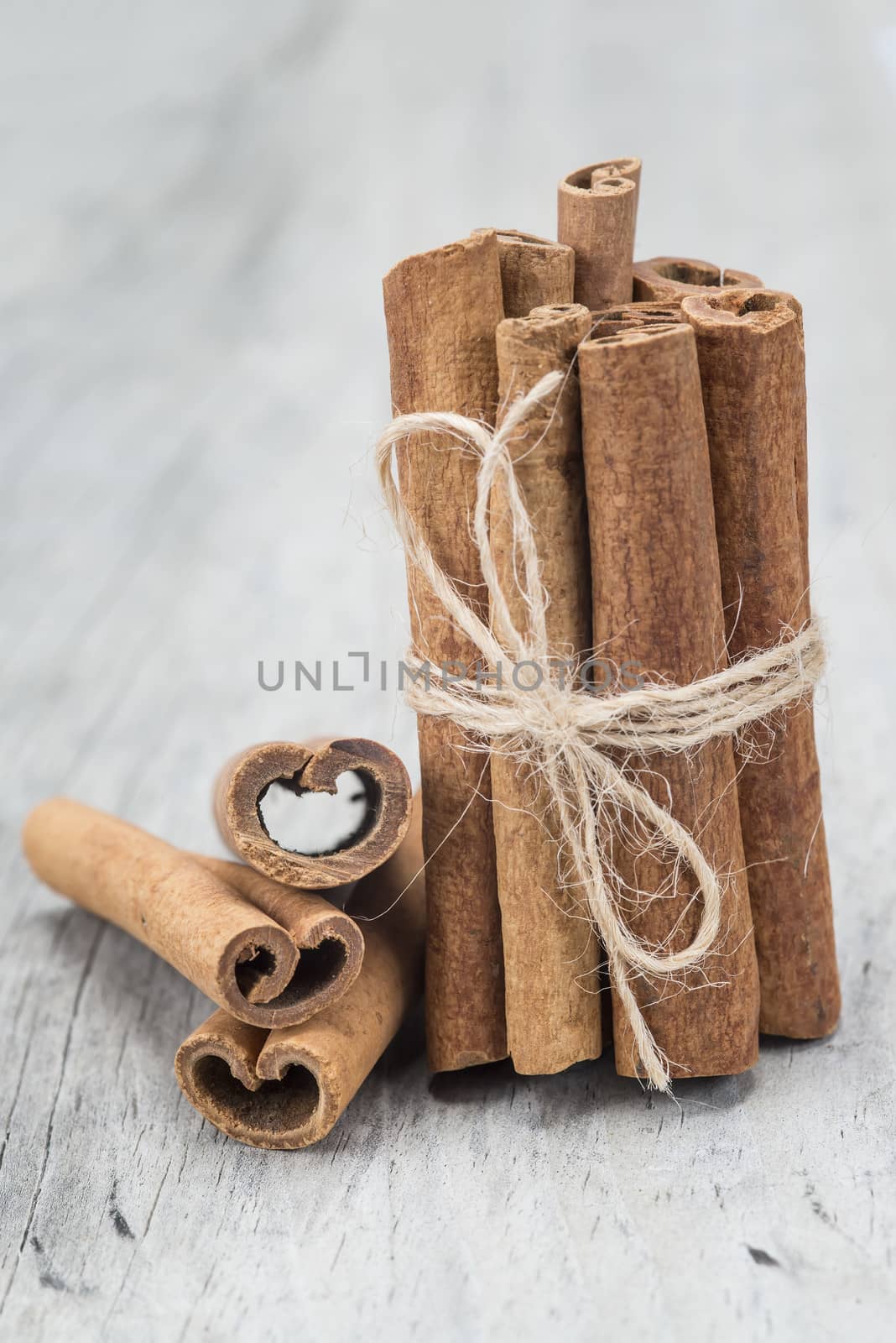 Cinnamon sticks on an old wooden table background