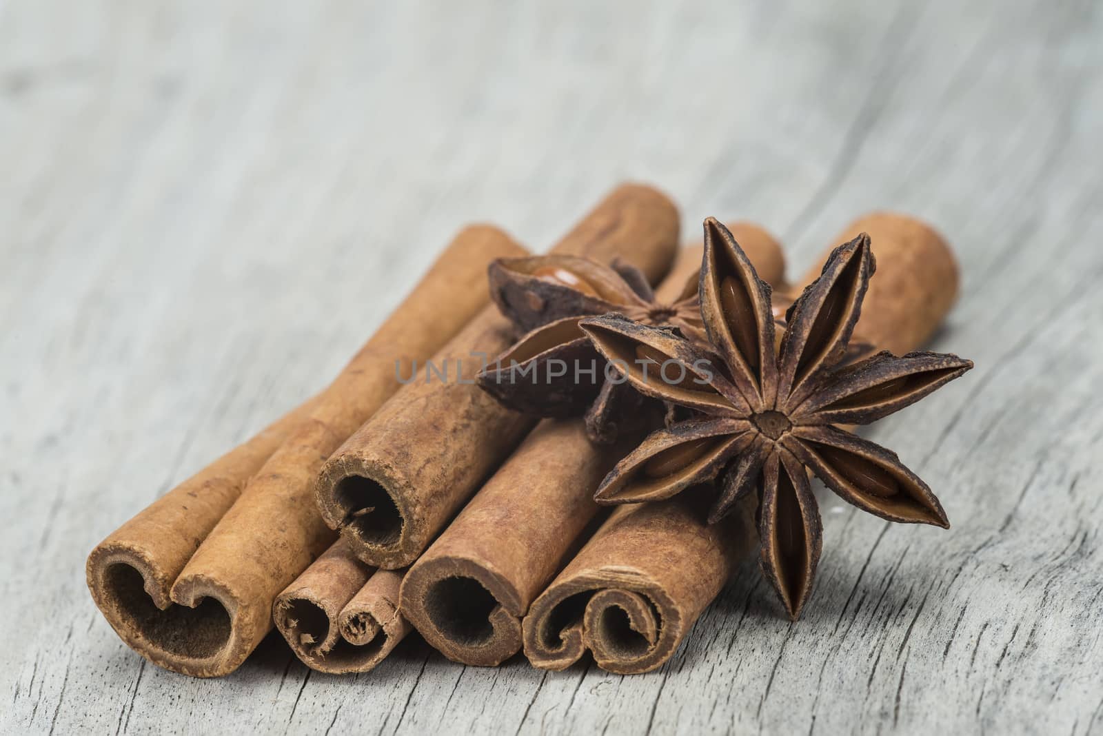 Cinnamon and star anise over wood by angelsimon