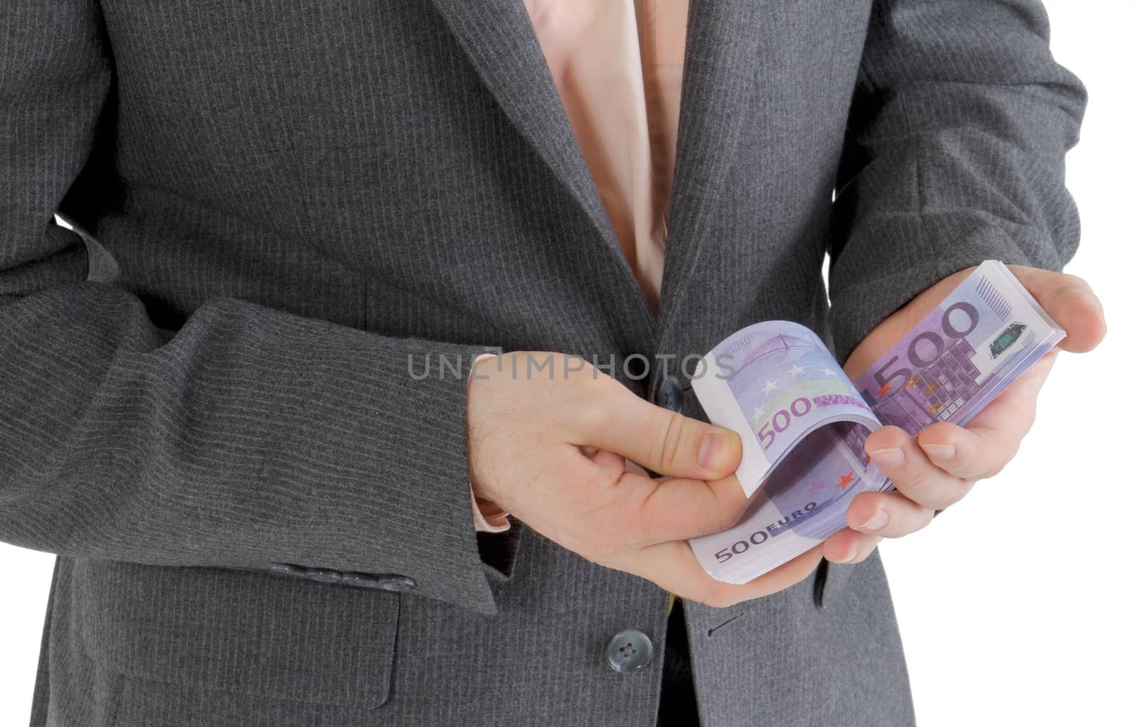 stack banknotes of 500 euro in male hands on a white background