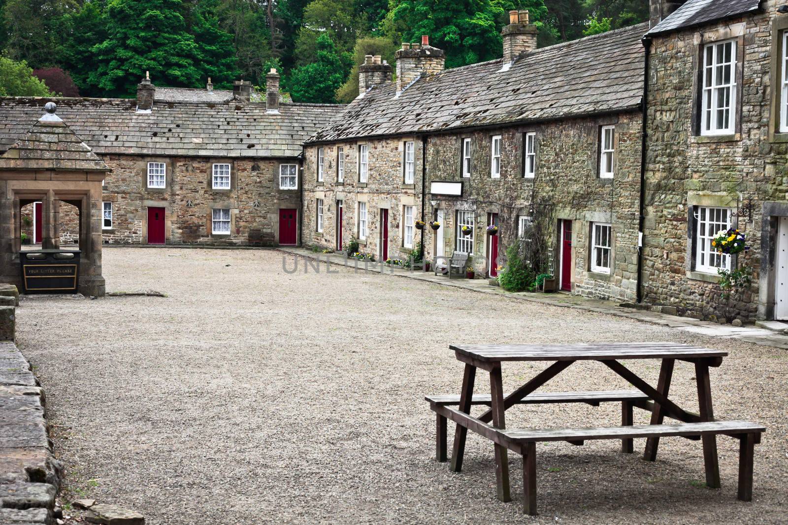 Stone cottages around a courtyard in Blanchland village, Northumberland