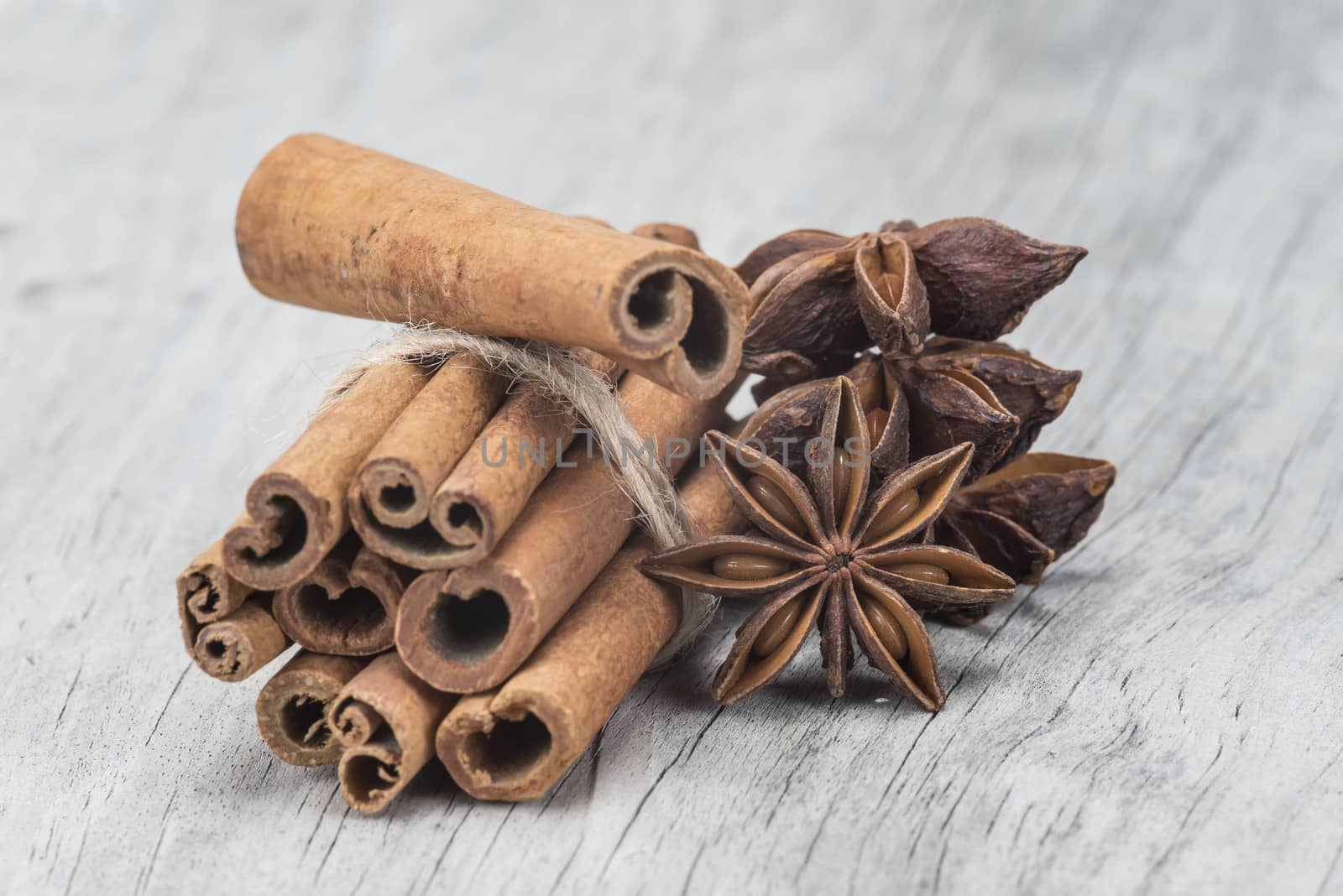 Cinnamon and star anise over wood by angelsimon