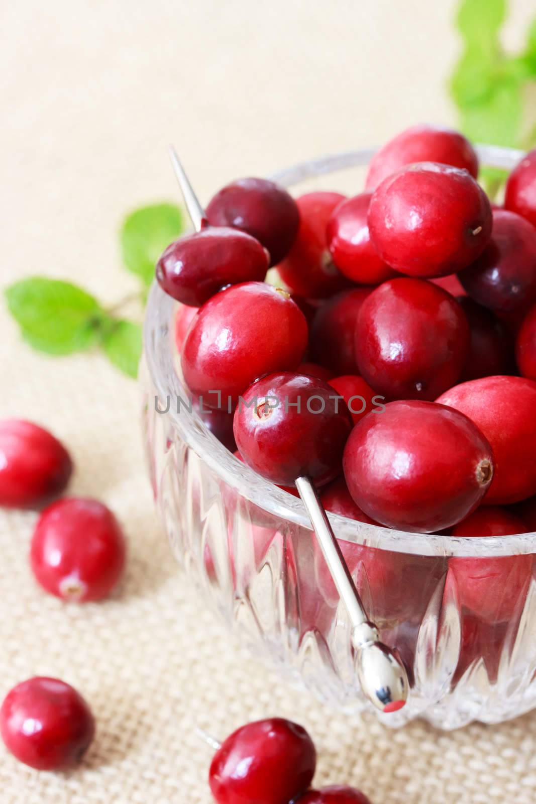 Fresh cranberries in a glass container