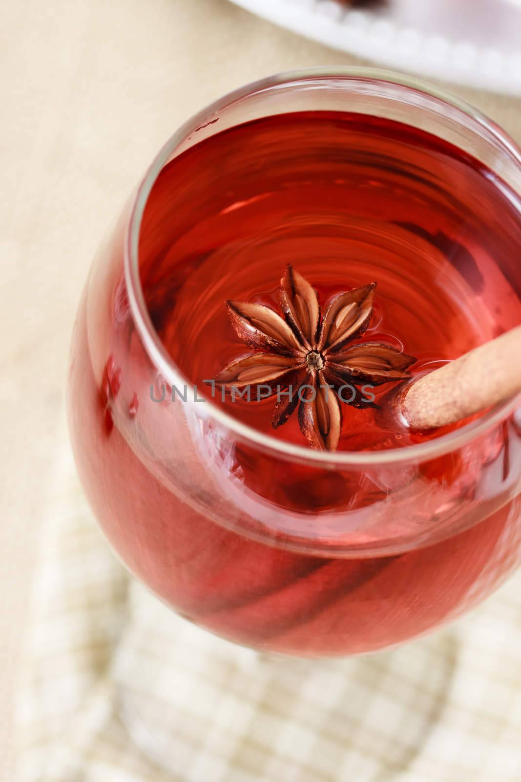 Herbal drink with star anise and a cinnamon stick