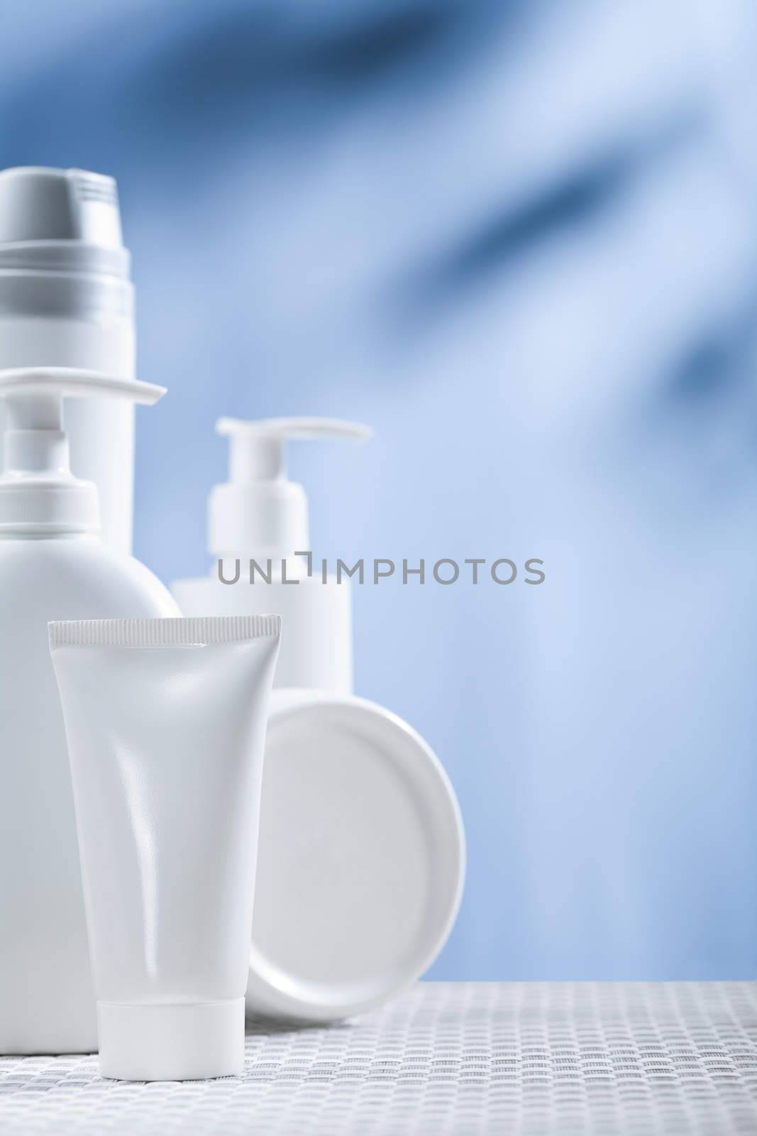 skincare items on blue background